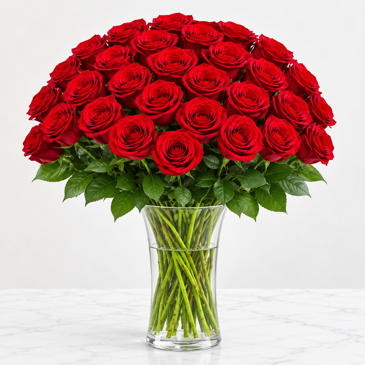 Bouquet of red roses in a clear glass vase