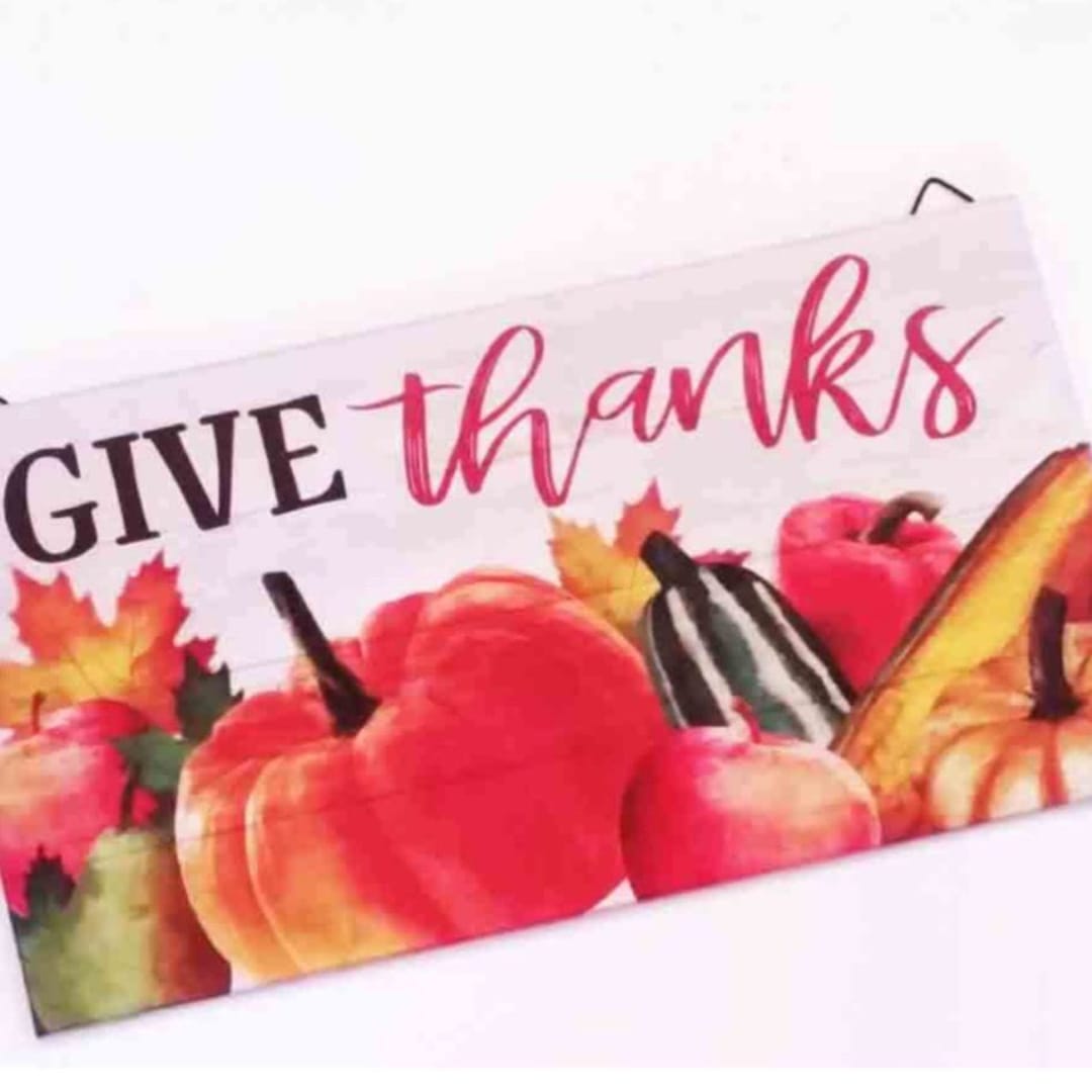 Fall-themed sign with pumpkins and the words "give thanks"
