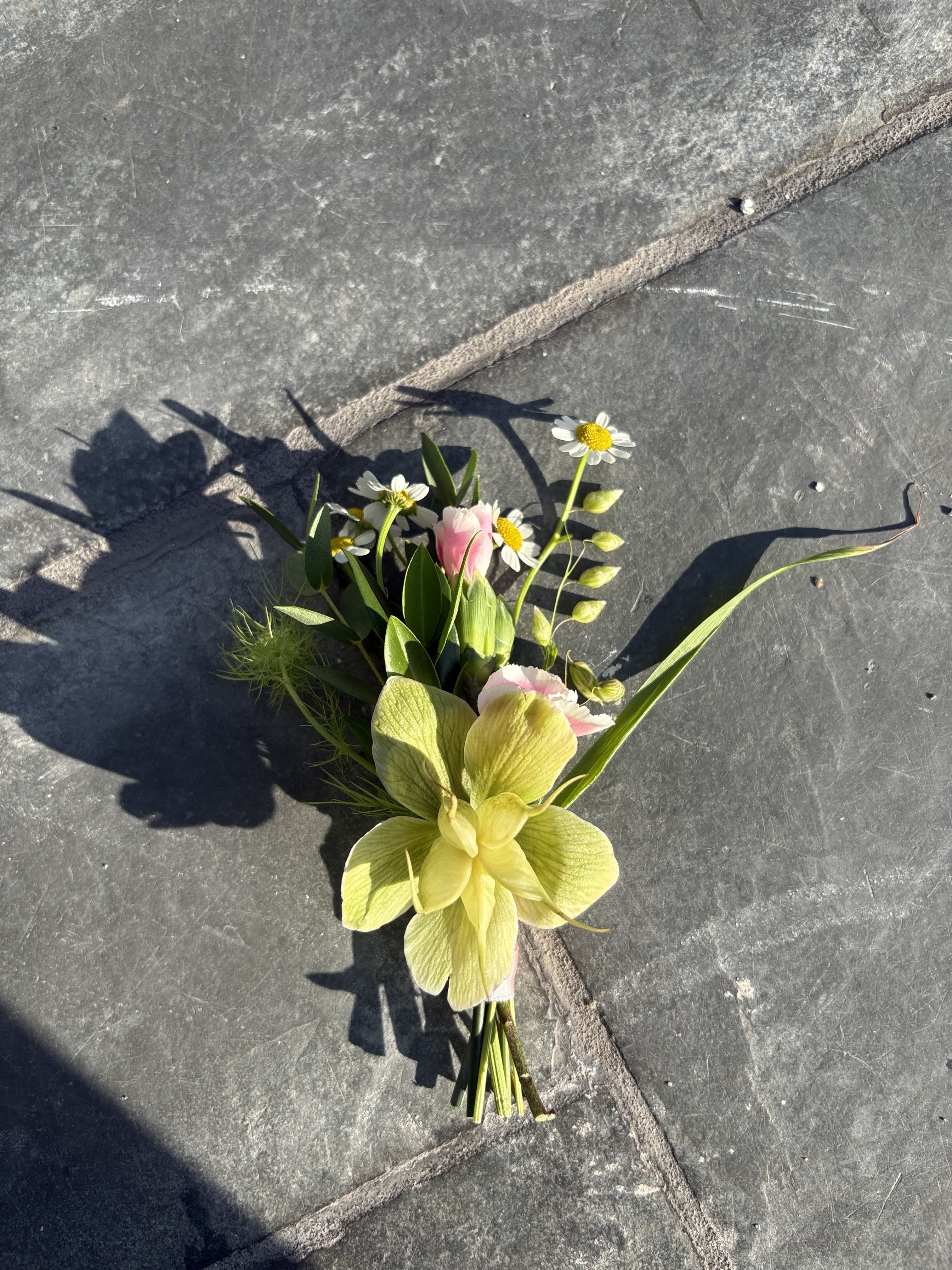 The Boutonnière  - The perfect adornment to elevate any lapel. Elevate your prom look with a unique and fun floral touch.   Please note that each boutonniere is made to order, should you have any color preference for the flowers and ribbon please share in the "Florist Notes" box during the ordering process.  