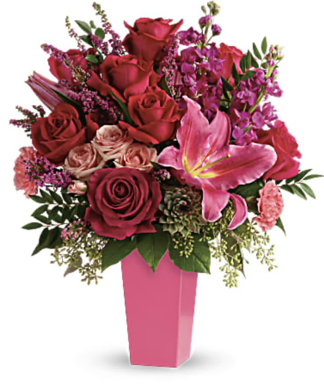 Tall pink vase with red and pink roses, a pink lily, carnations, stock, and a succulent.