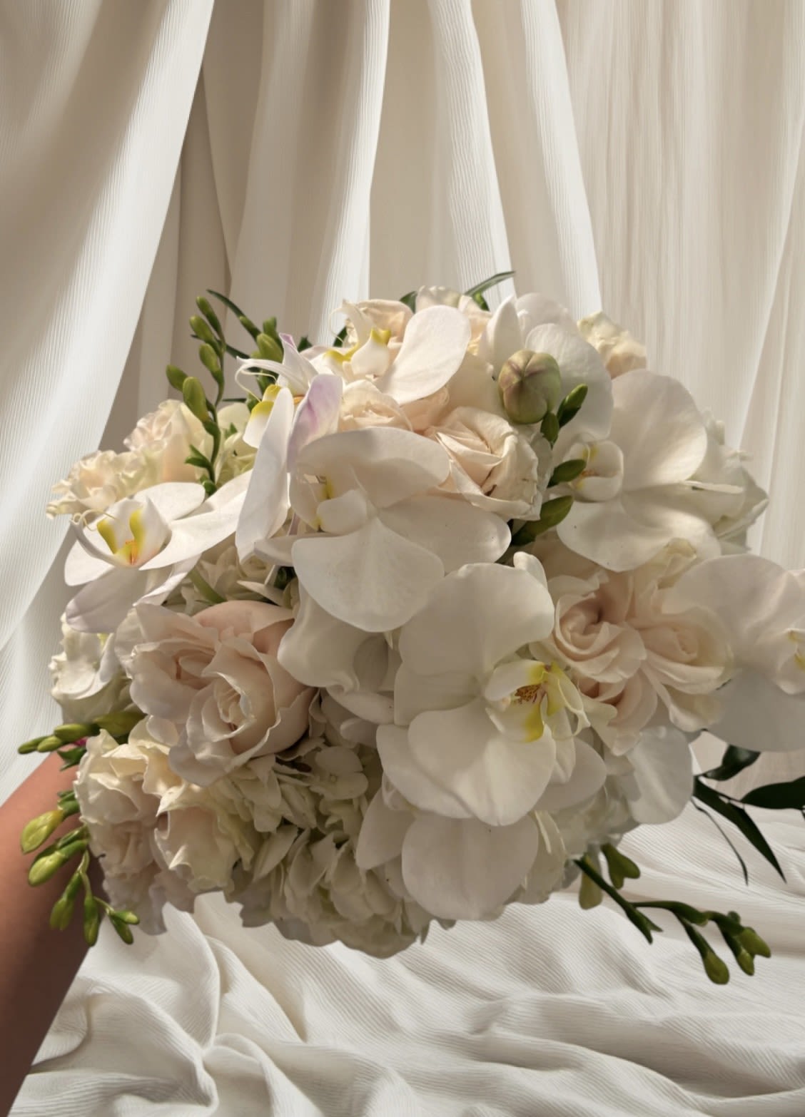White orchid and pale blush rose bouquet
