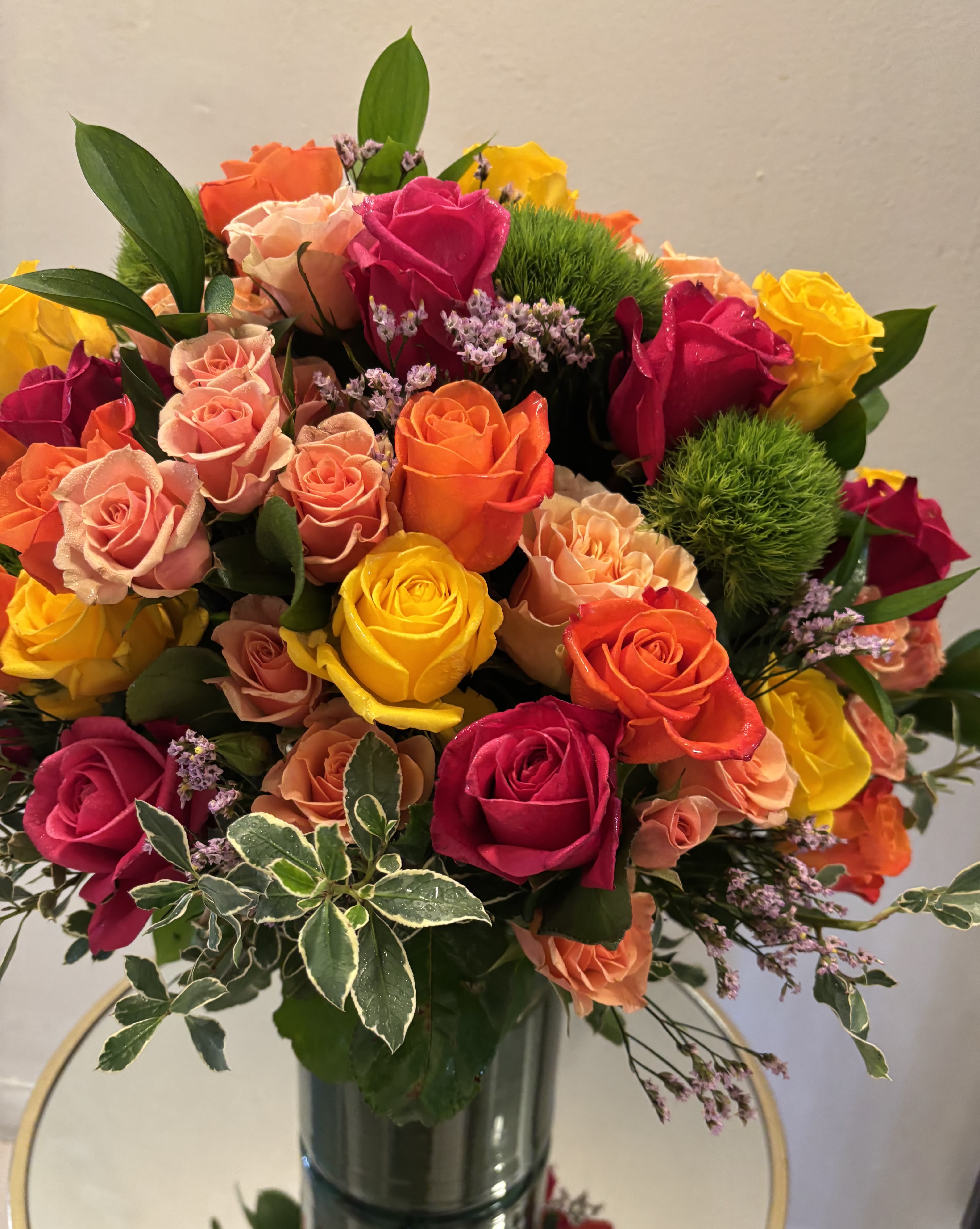 Kaleidoscope by BloomNation™ - A full-color explosion, Kaleidoscope by BloomNation™ is a beautiful gift for anybody you want to impress. Mother-in-law, your boss, a client, etc... this arrangement is a crowd pleaser and an eye-catcher.  Approximate Dimensions: 14"D x 14"H