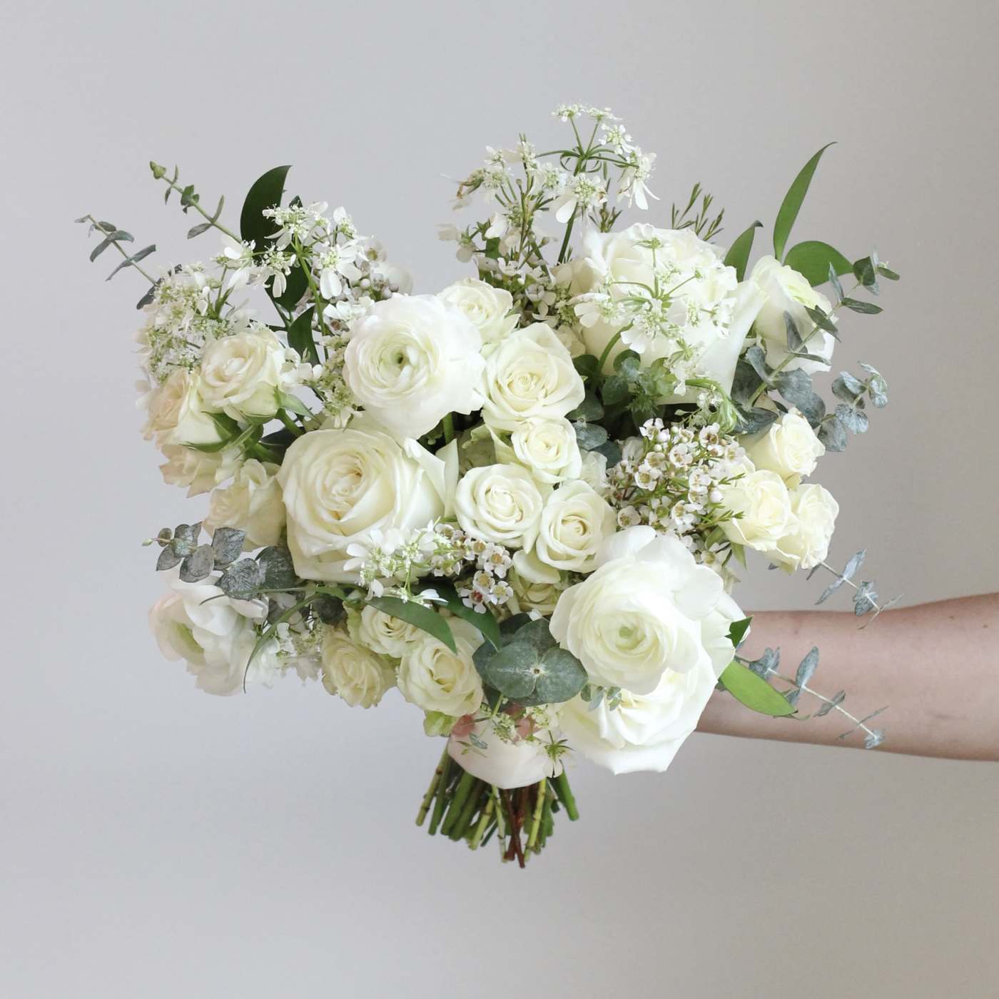 White rose bouquet with airy filler flowers and eucalyptus