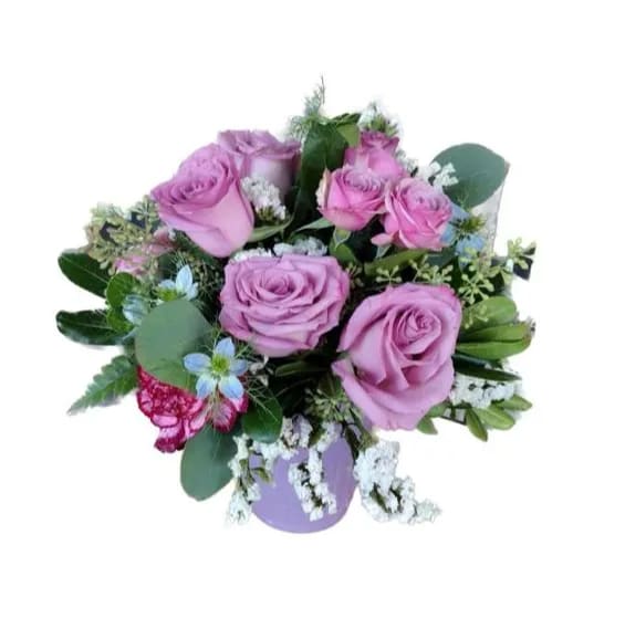 Bouquet of lavender roses with white filler flowers and greenery