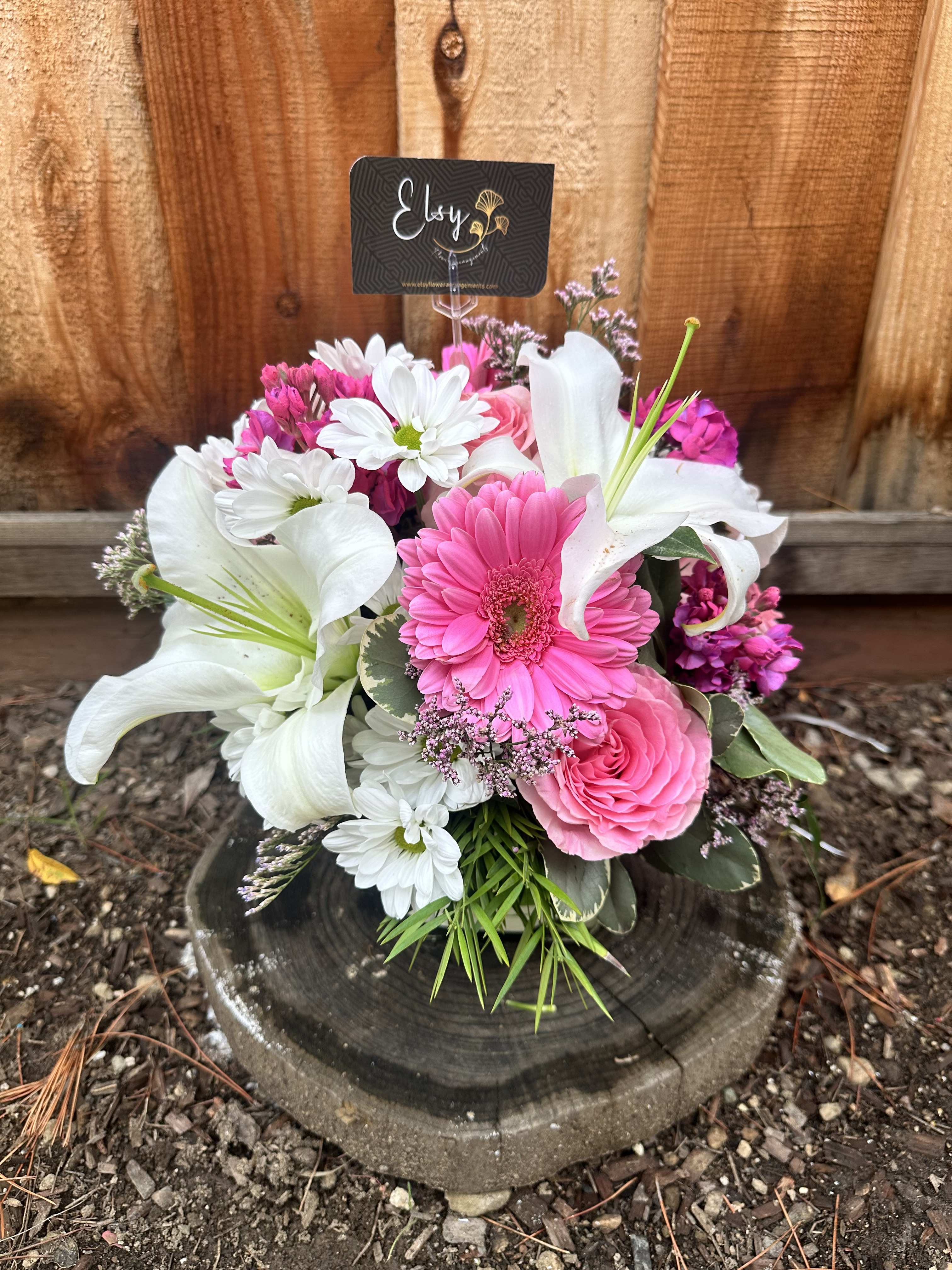 Pink and white mixed bouquet with lilies, daisies, and roses