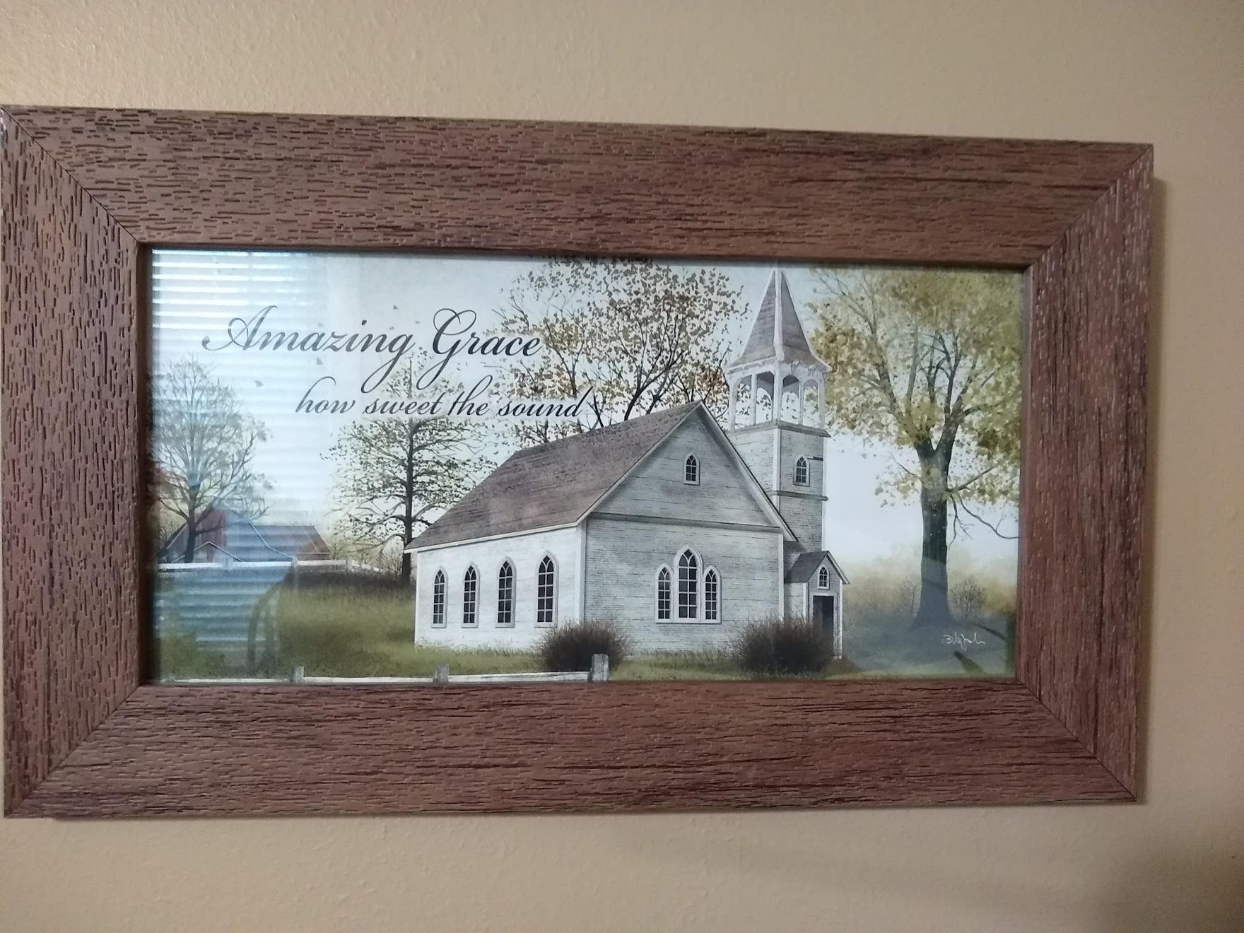 Framed wall art of a white church with the words Amazing Grace