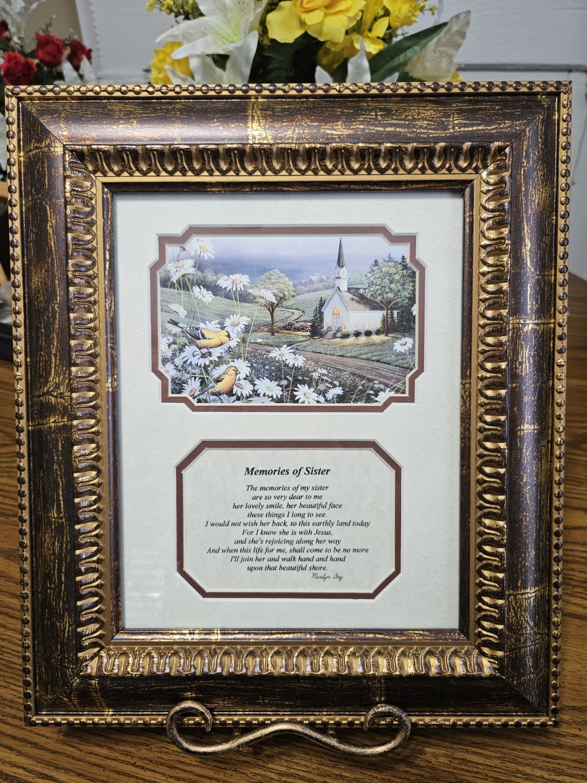 Framed memorial print with a church scene and poem