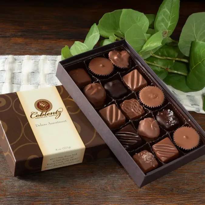 Coblentz Medium Boxed Chocolates -  A sweet way to show them you care, for any occasion!  Filled with Top selling assortment of milk and dark items in a  classic gift box  Made in United States Contains: Milk, Peanuts, Soy, Tree nuts, and Wheat