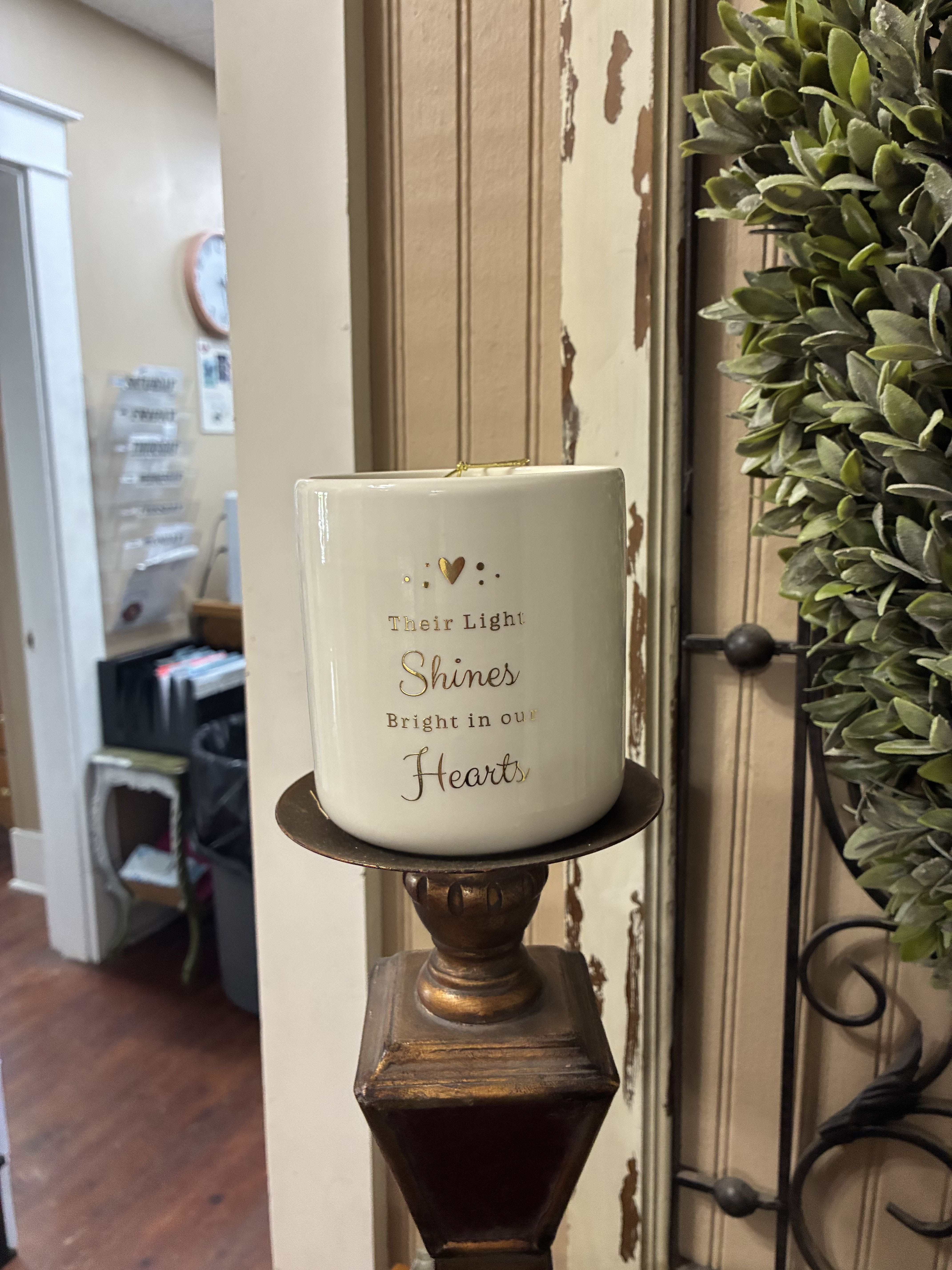 Remembrance Jar Candle - Our Remembrance Vanilla Bean 1-Wick Jar Candle emits a light, sweet scent that creates a comforting ambience. The heartfelt sentiment makes it a thoughtful gift for anyone who has lost a loved one.  Candle measures 3.4H x 4.1 in. in diameter 18.7 oz. Vanilla candle White ceramic jar container Features the text "Their light shines bright in our hearts" Paraffin wax