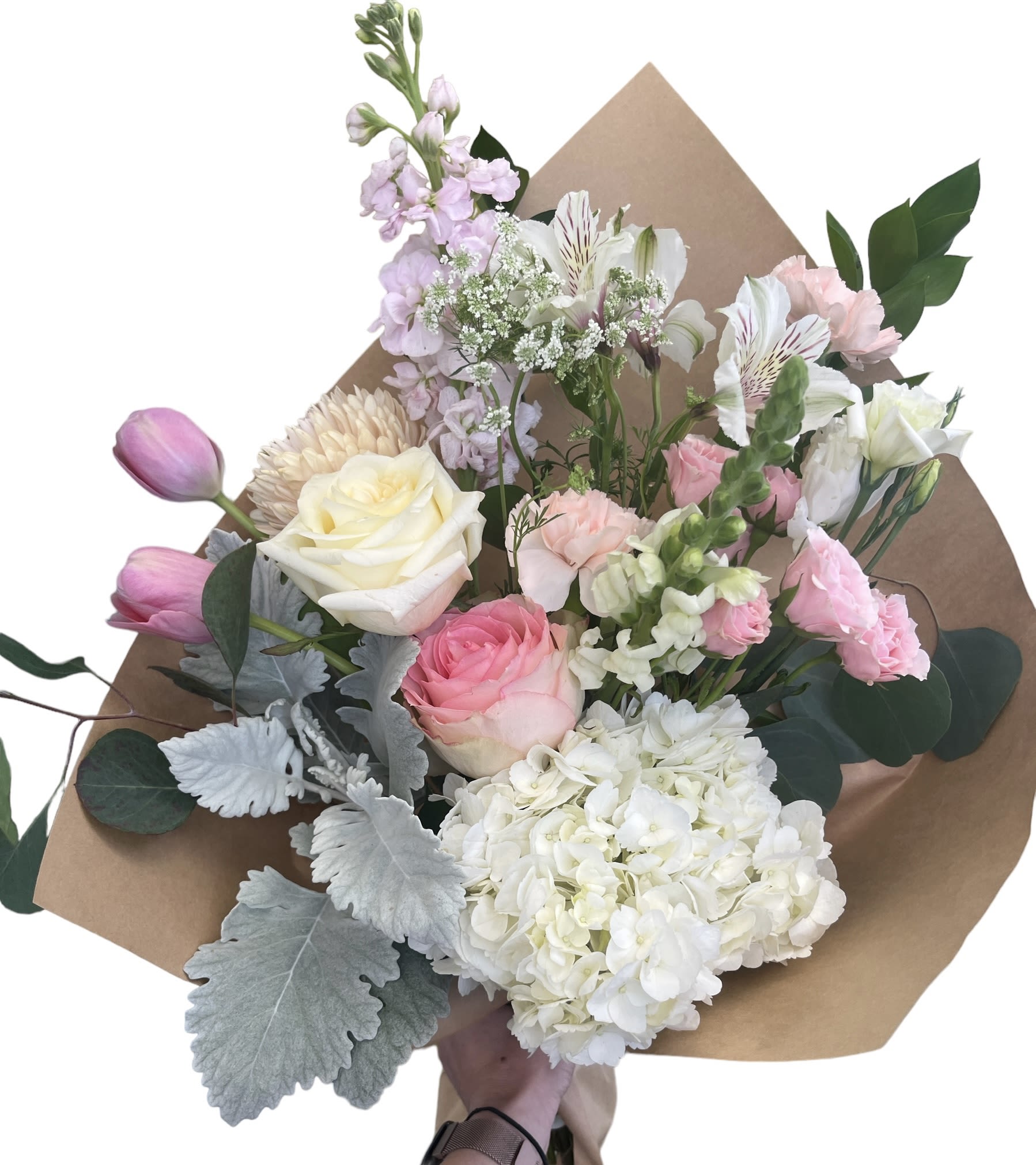 Hand-tied bouquet of pink and white flowers wrapped in brown paper