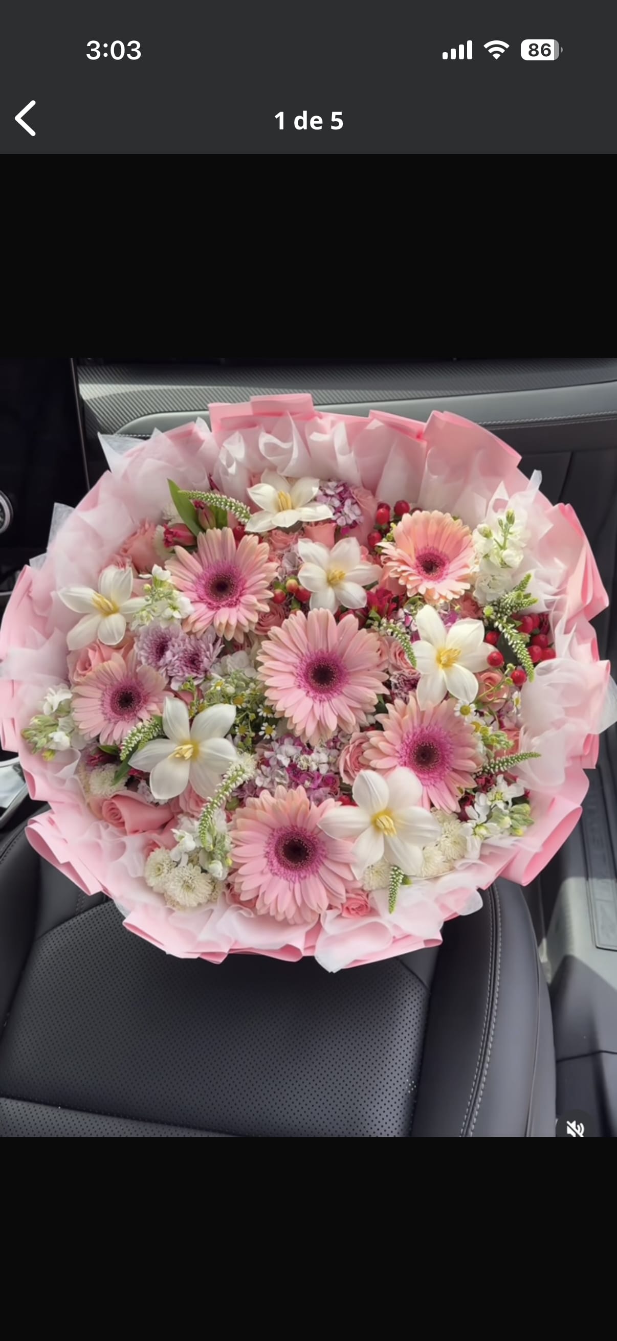 Pink bouquet with gerbera daisies and white flowers wrapped in pink paper