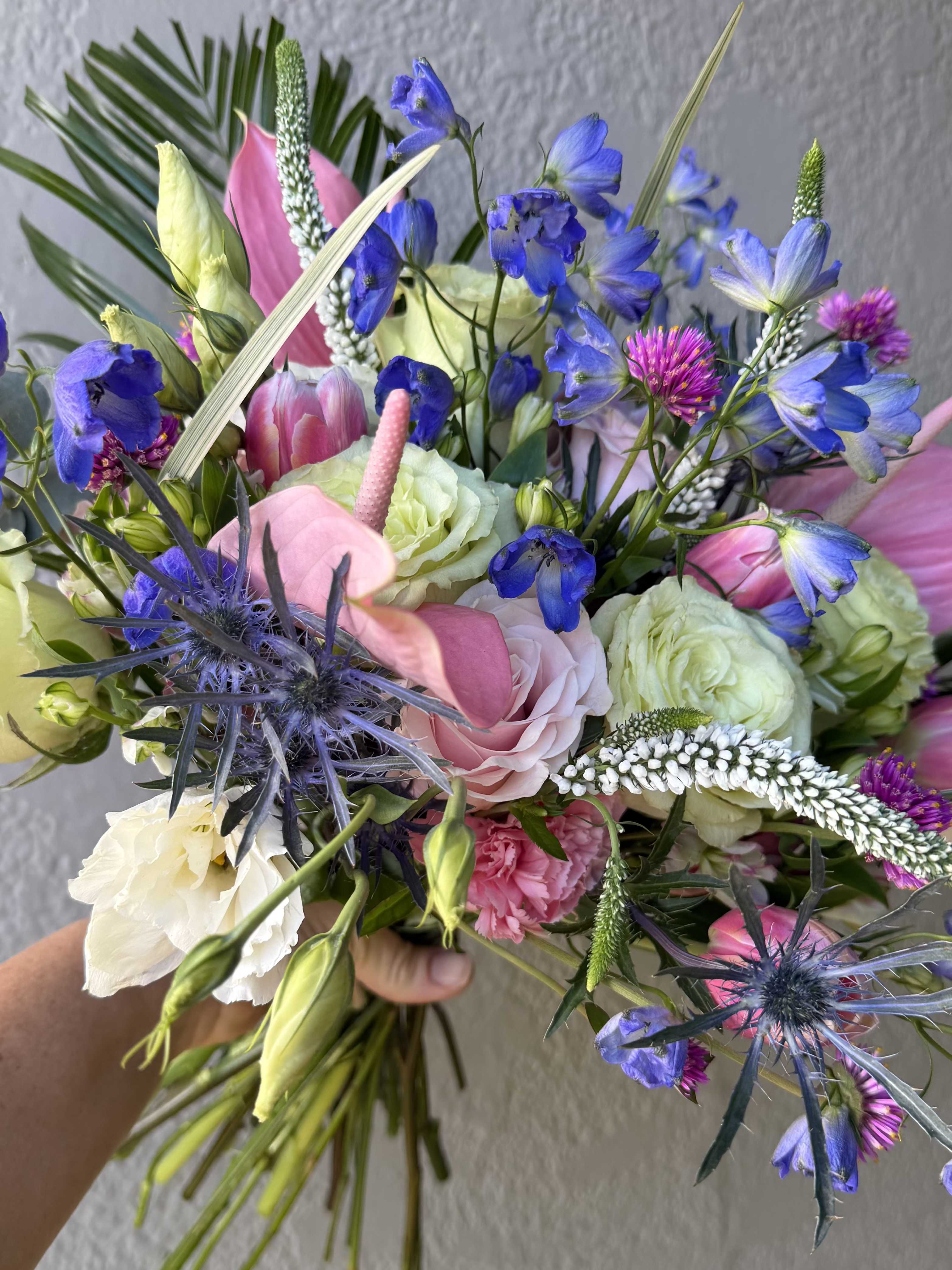 Hand wrapped bouquet - Hand wrapped bouquet in various colors and premium flowers,  we will choose the best blooms in season.   Designs will vary