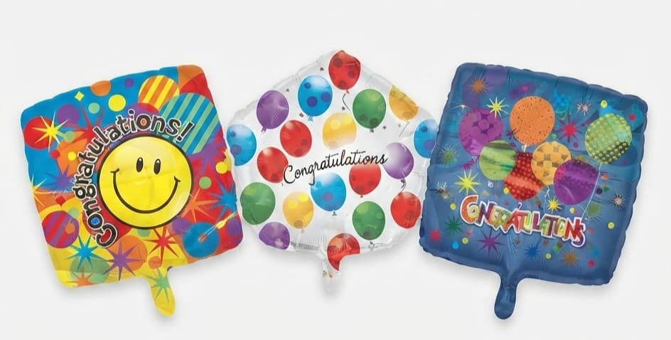 Three square congratulatory balloons with colorful patterns and text