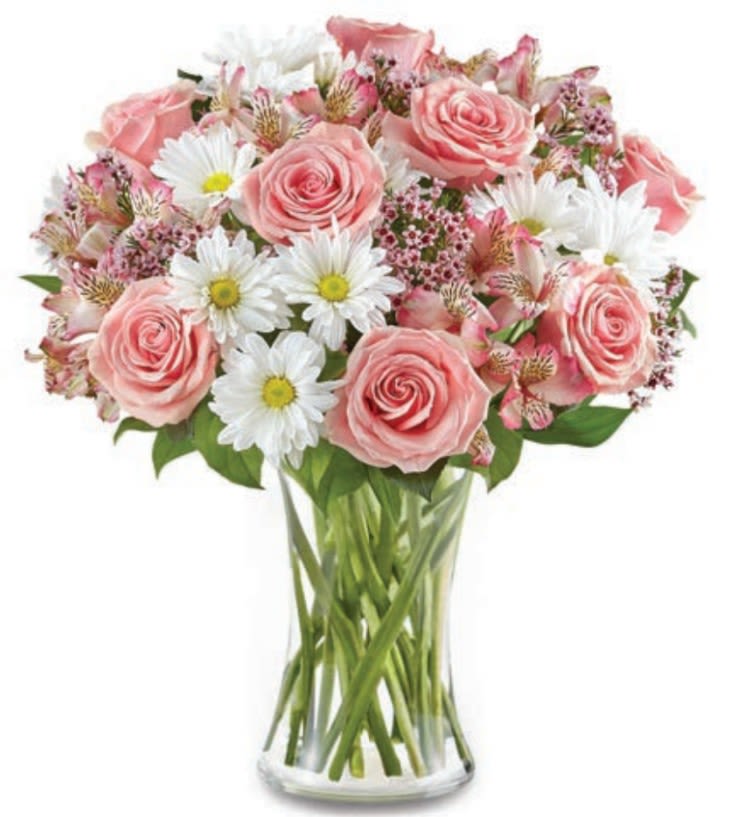 Pink roses and white daisies in a clear glass vase