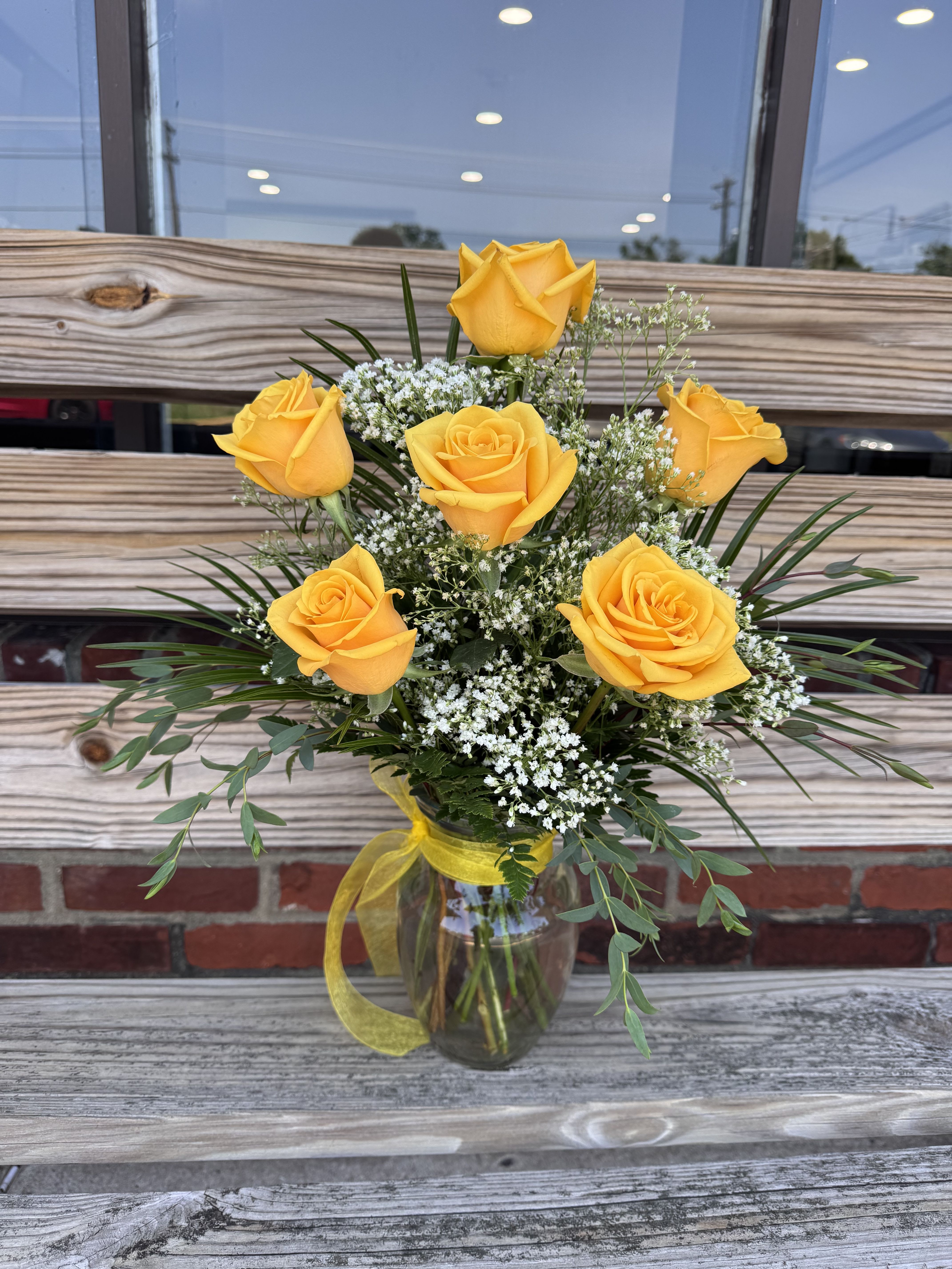 Sunshine Garden - Bring a smile to their face with this joyful arrangement. Featuring a half dozen yellow roses. 