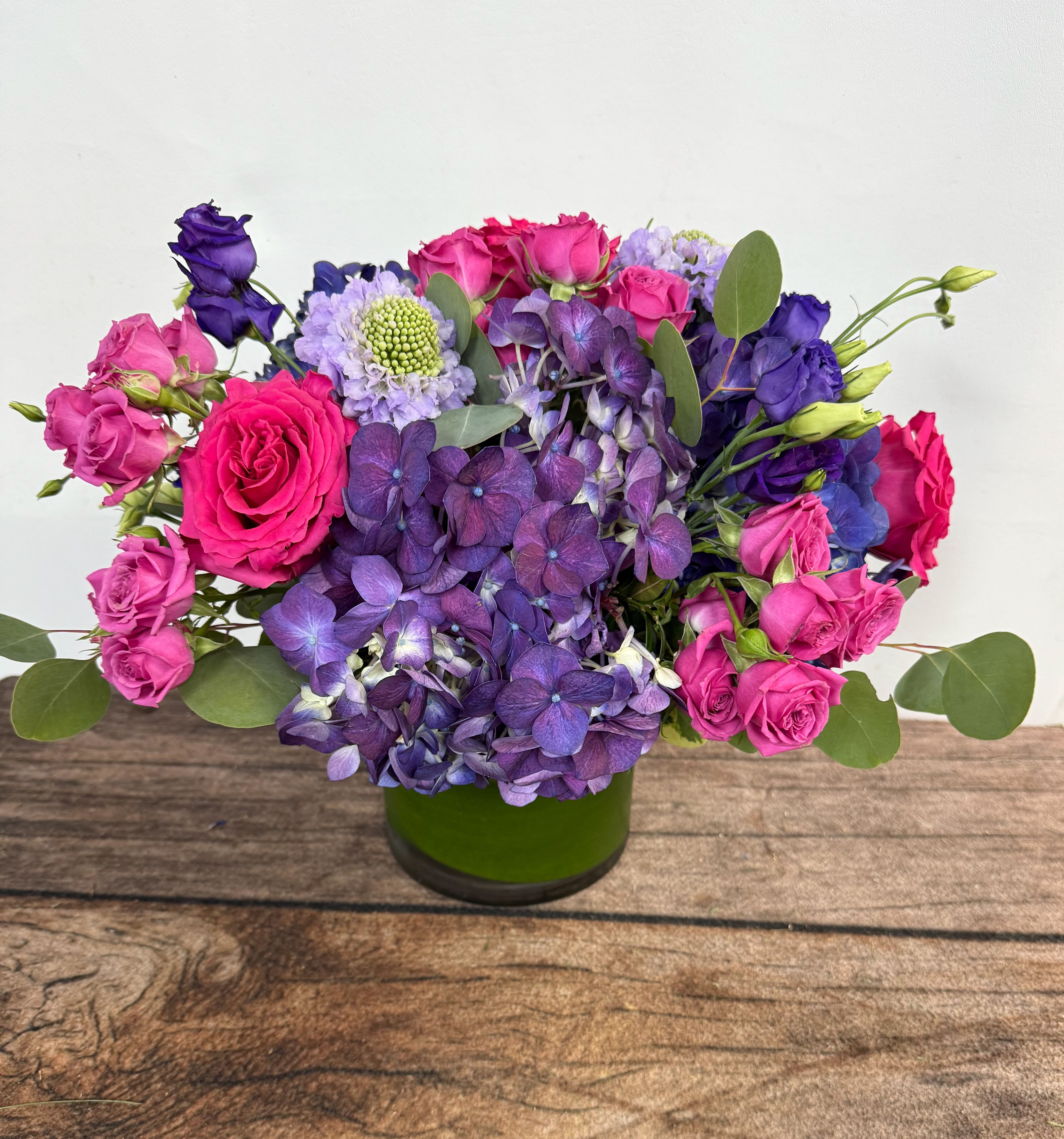 Flirty - Hydrangea and perfect pops of color. A fun arrangement.