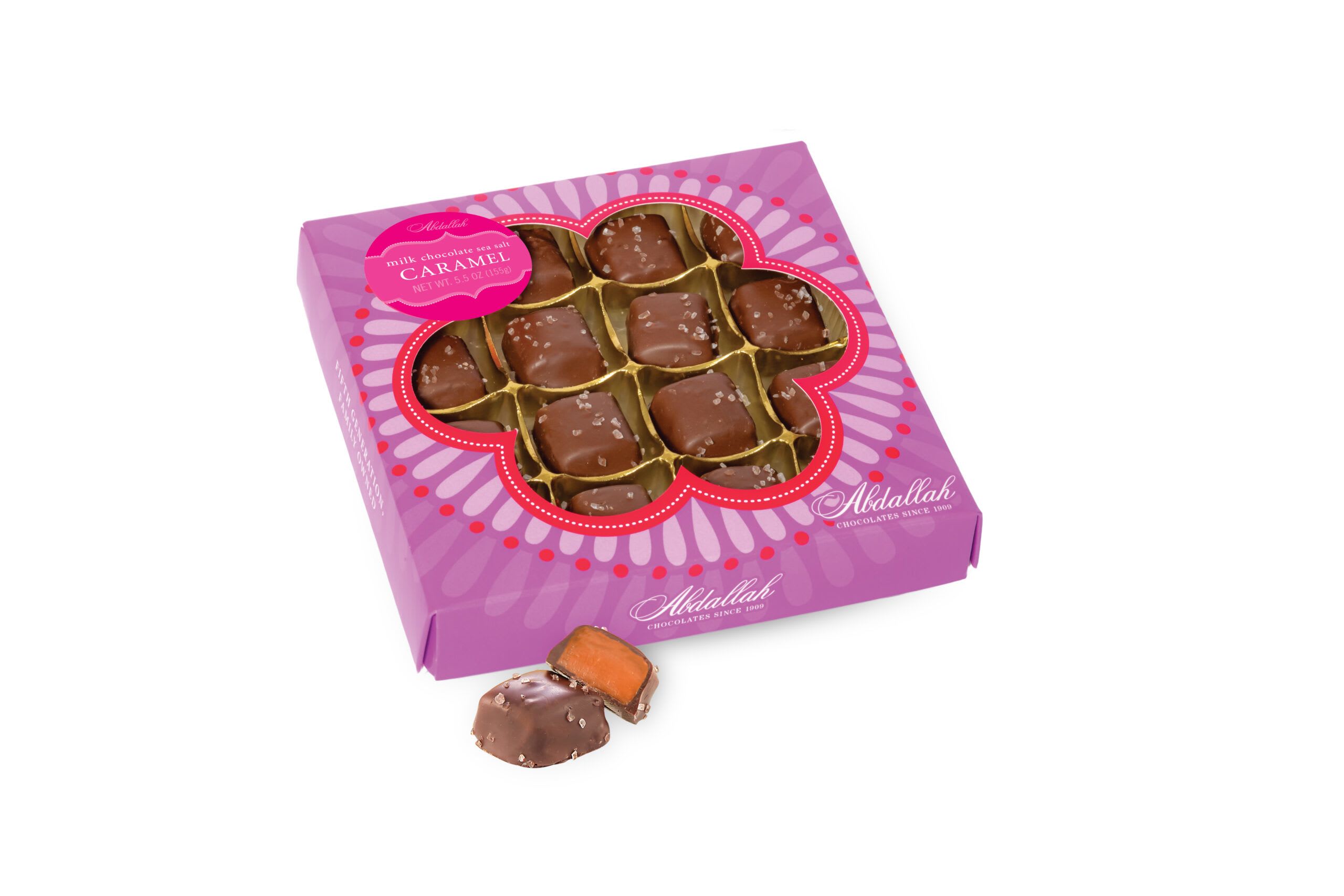 Box of milk chocolate sea salt caramels with one piece outside the box