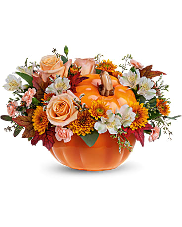 Hello Pumpkin Bouquet -  Welcome Fall into your home with this warm and cozy, Hello Pumpkin arrangement. The autumnal mix will add a sophisticated touch with crème roses combined with the warm hues of bronze chrysanthemums and peach mini carnations!      This charming arrangement features crème roses, white alstroemerias, peach miniature carnations, bronze cushion spray chrysanthemums, and seeded eucalyptus. Delivered in Teleflora's Hauntingly Pretty Pumpkin.  