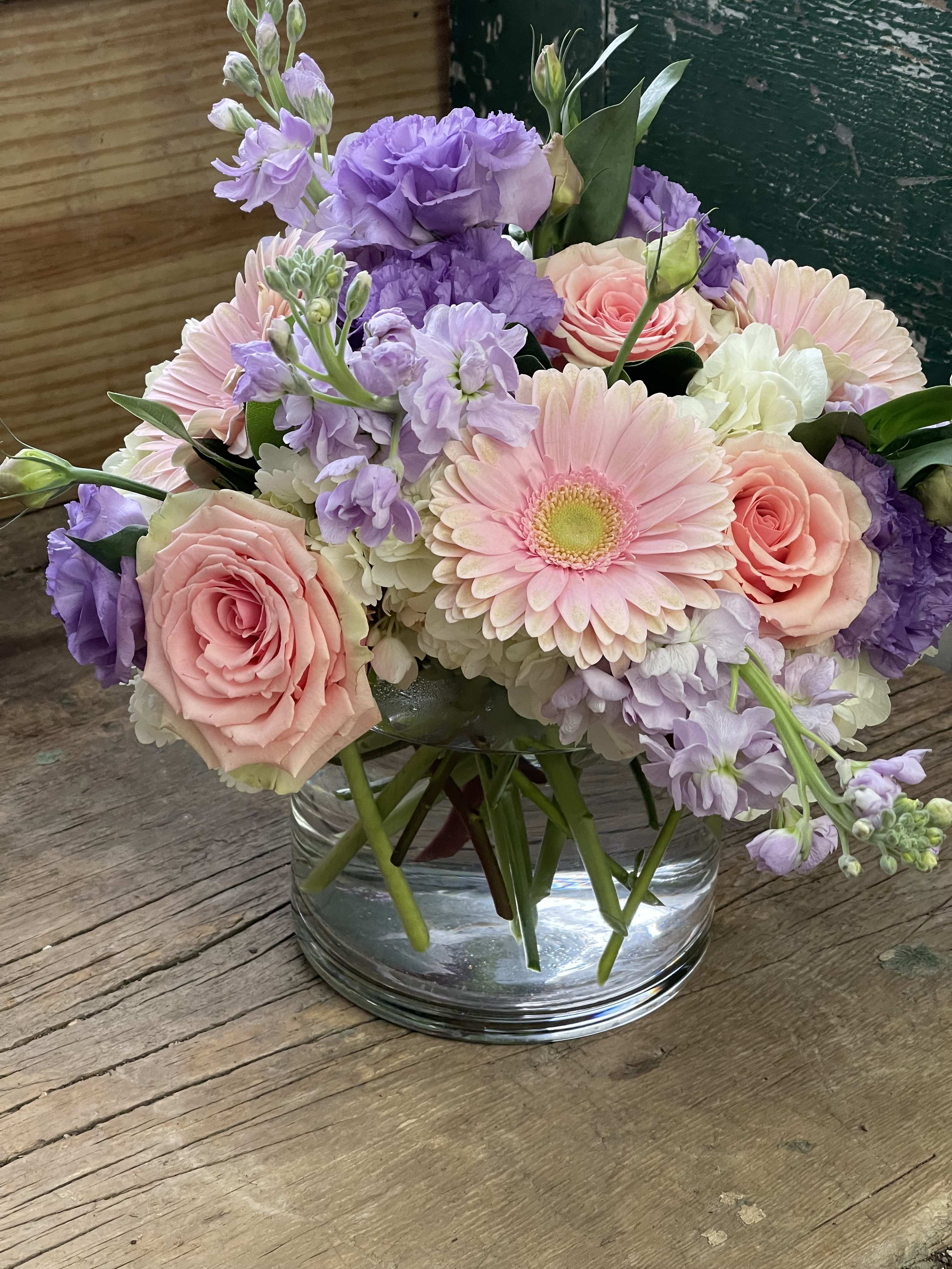 Pink and lavender bouquet in a clear glass vase