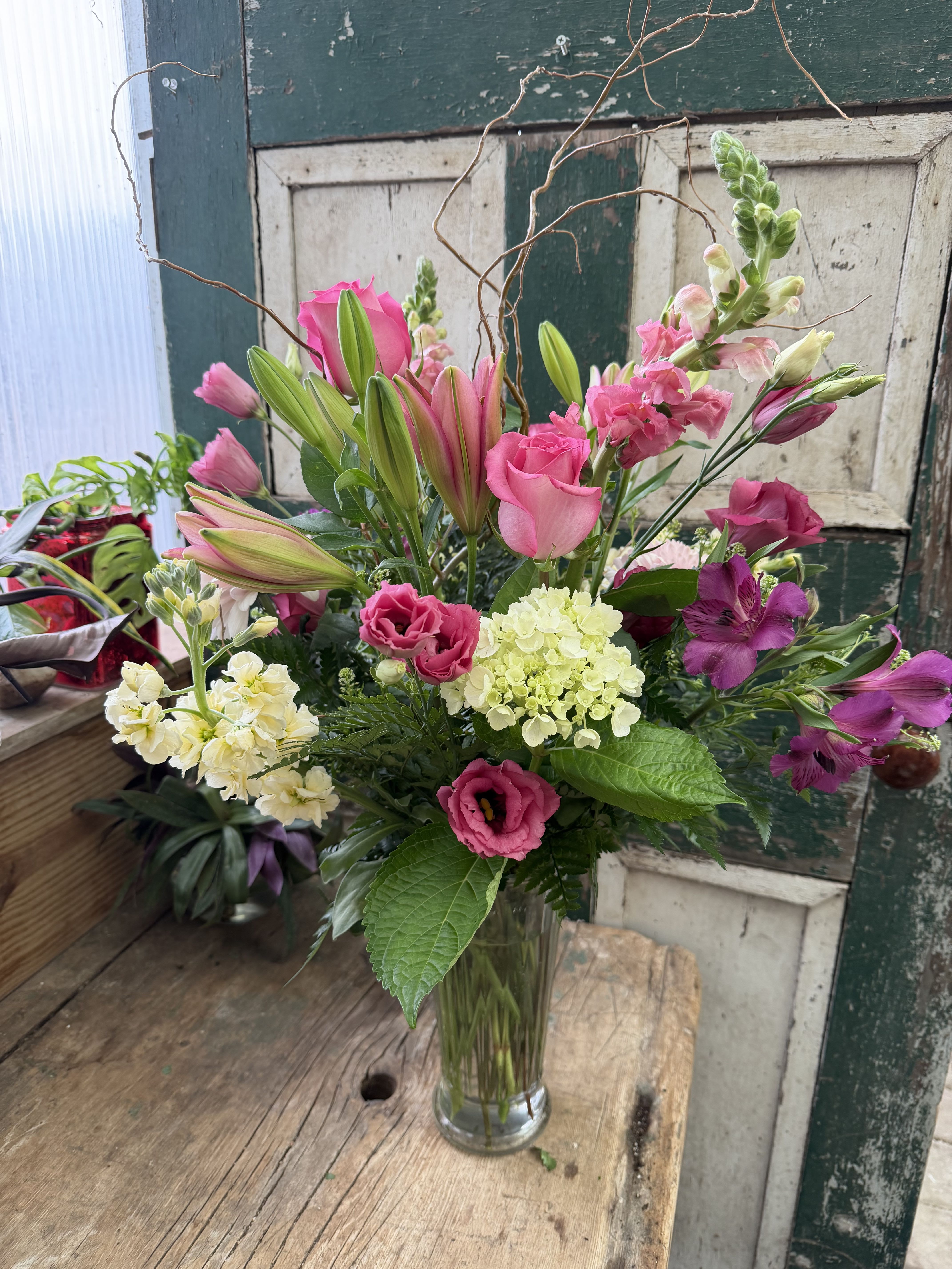 Pink and white mixed bouquet in a clear glass vase
