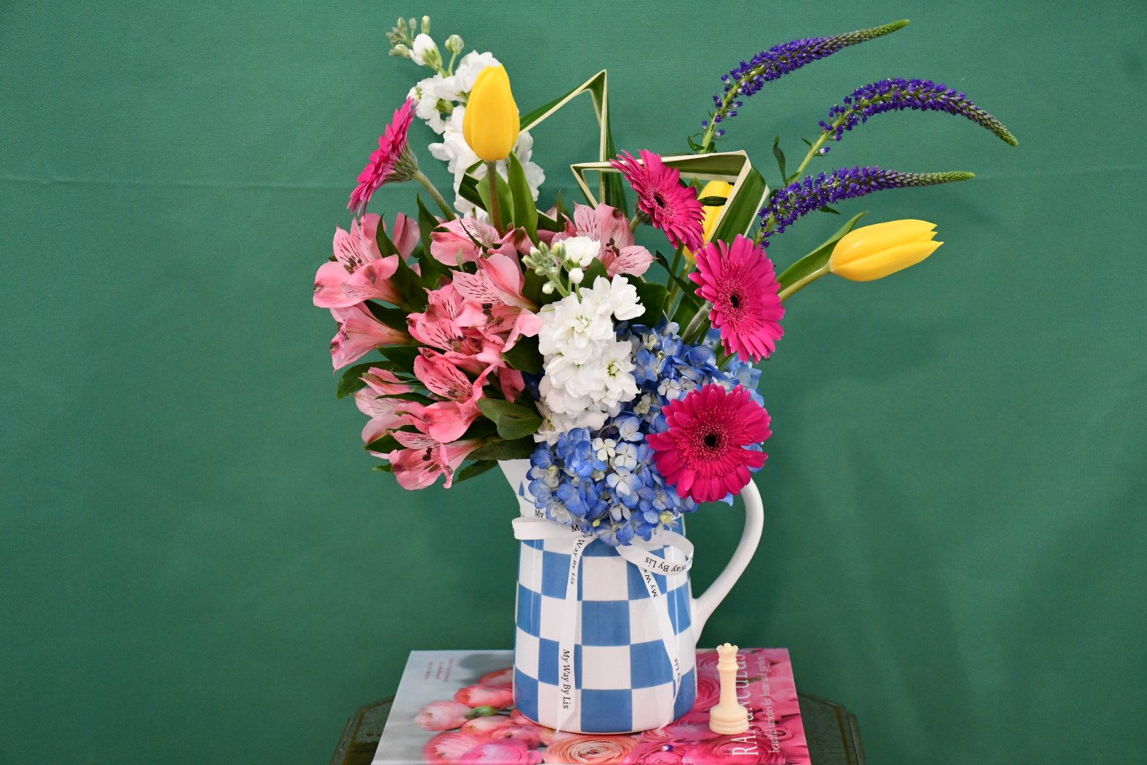 Peggy. - Cheerful and colorful arrangement in one of our favorite vases!