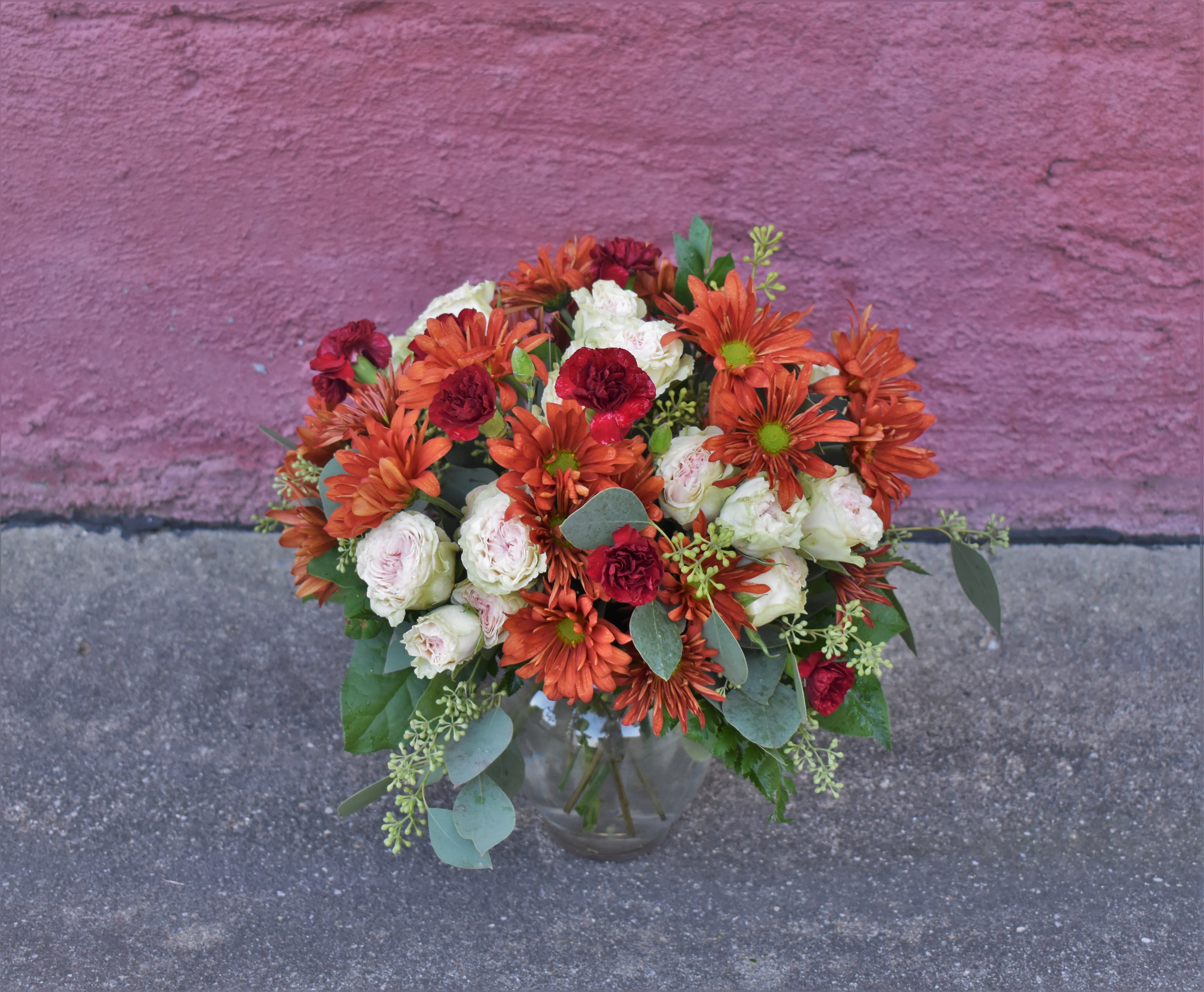 Bronze Autumn Bouquet - Autumn is a time to celebrate! A season full of rich and vibrant colors and textures, This bouquet is brimming with fall mums, spray roses and mini carnations making a long-lasting design, perfect for celebrating any occasion! 