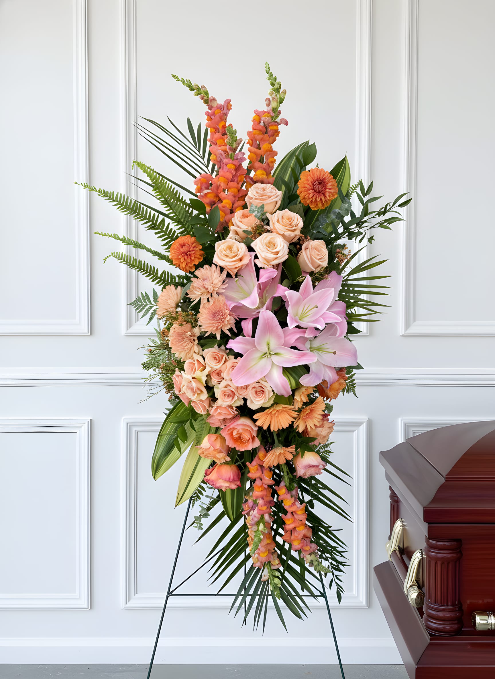 Sunset Spray - Thoughtfully designed, this spray is a collection of warm-toned flowers that radiate love and happiness.