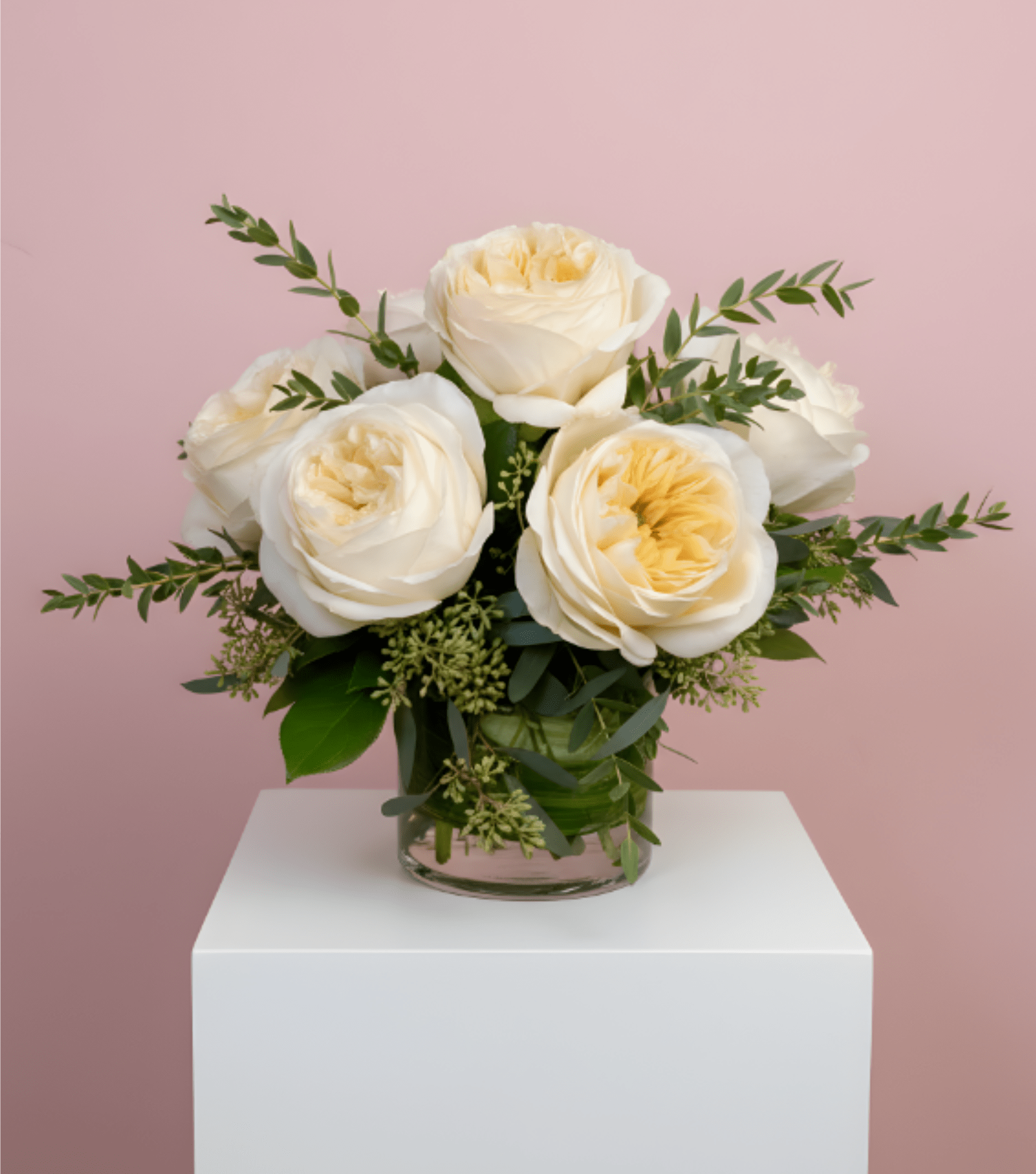Garden Roses - A half dozen Garden Roses arranged in a flared cylinder vase. The color of the roses may vary depending on availability!