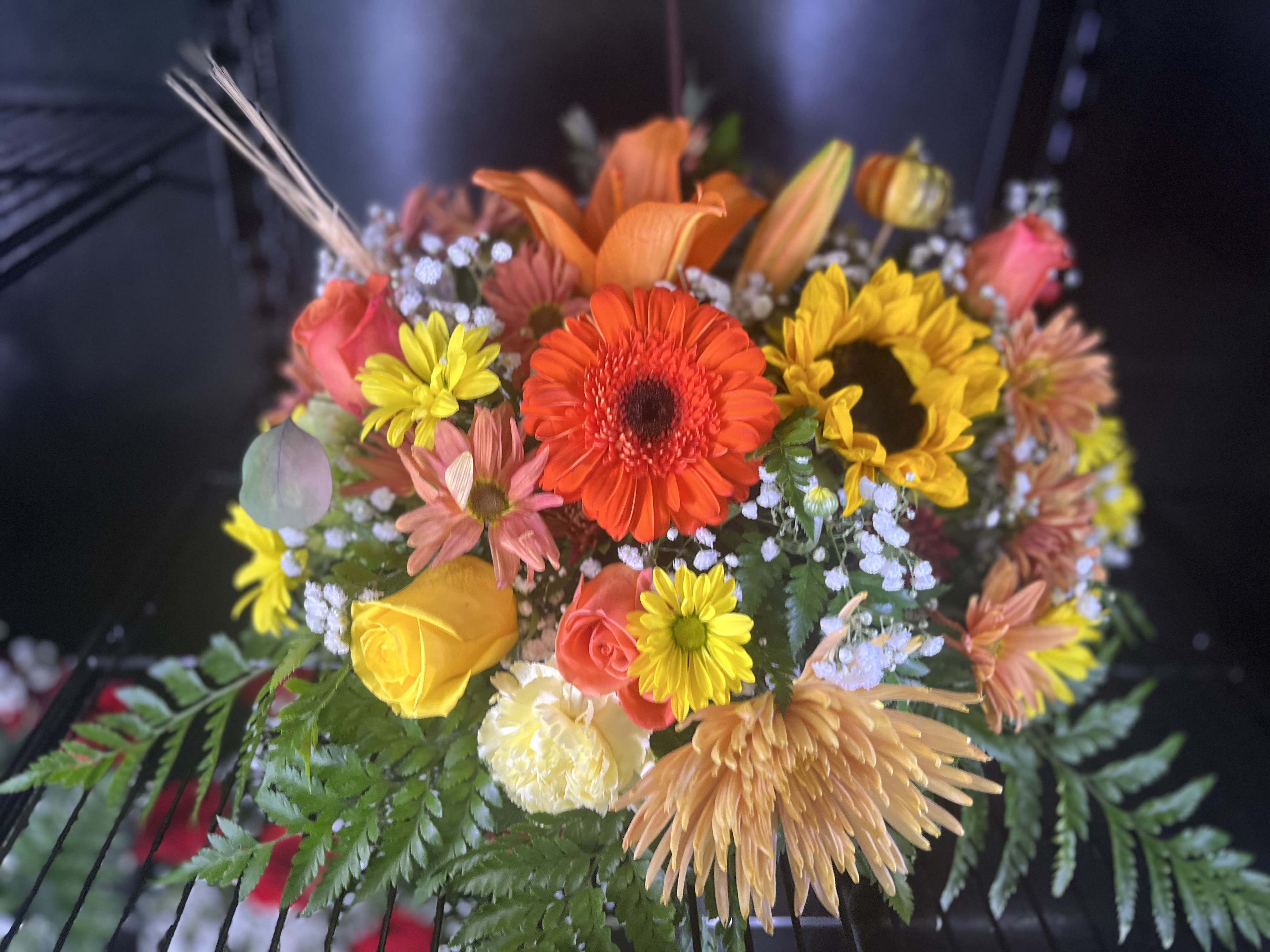 Mixed bouquet with sunflowers, roses, and gerbera daisies
