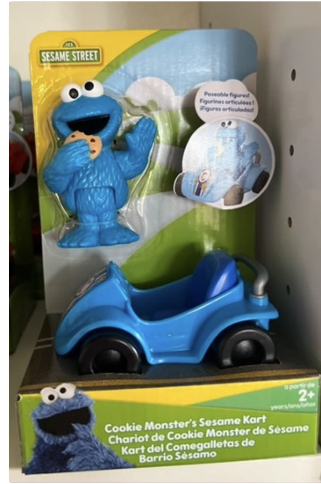 Sesame Street Cookie Monster toy in a blue kart package