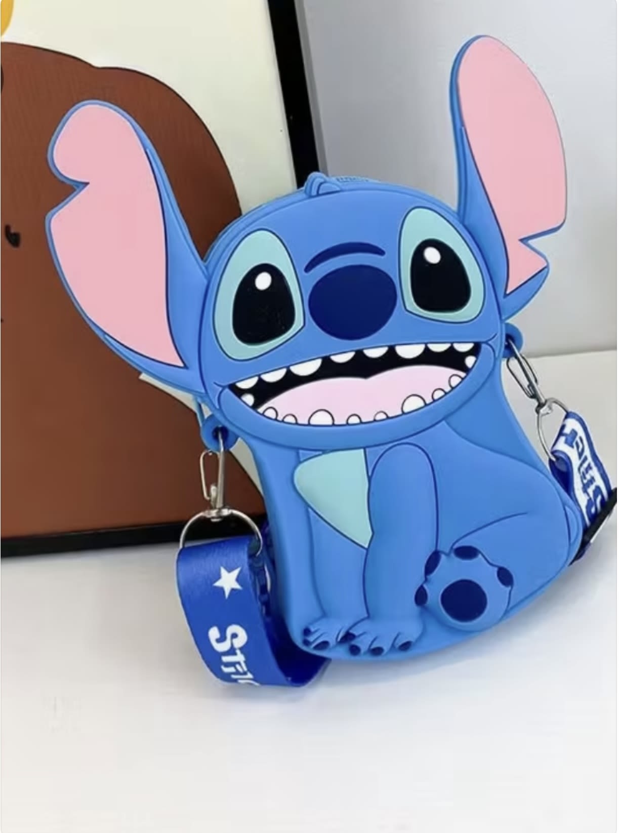 Blue Stitch-shaped bag with a shoulder strap