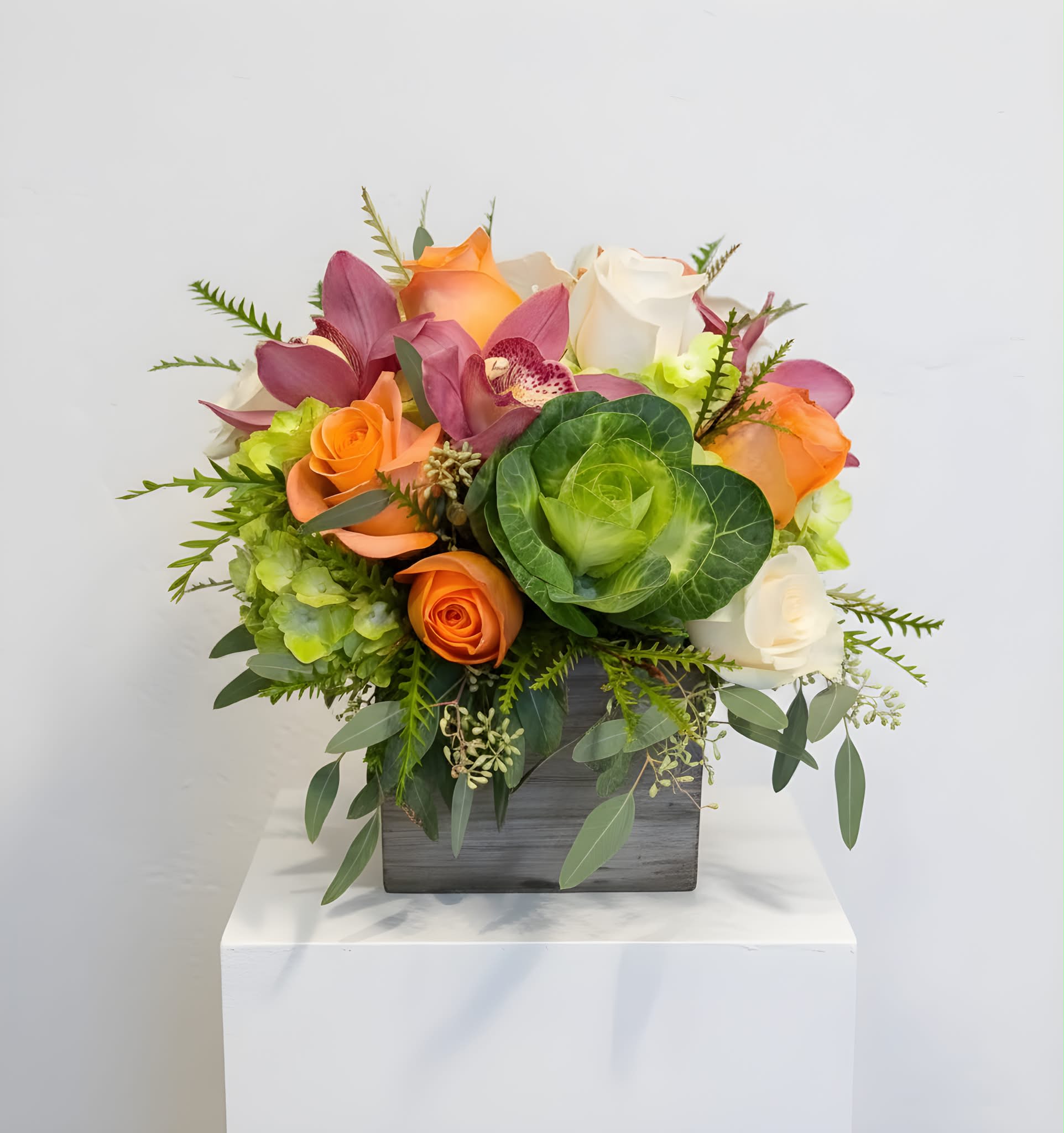 Cali Cool - This arrangement is a 360 design, arranged in a wooden box. Subtle enough for any occasion, but cheerful and vibrant like the Cali sun.
