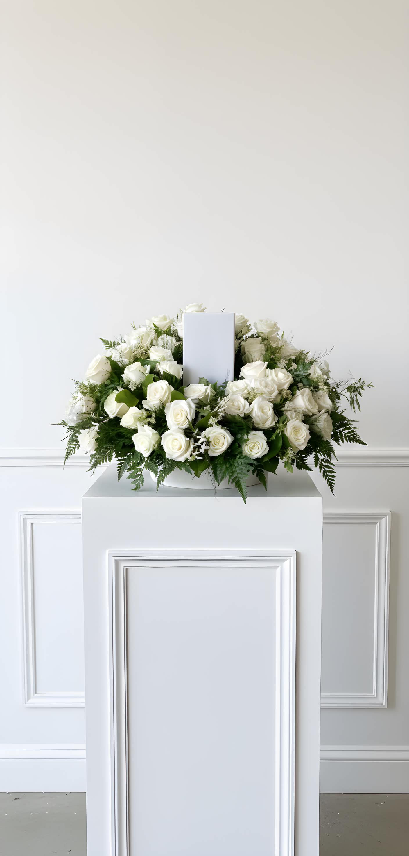 premium White Rose Urn Arrangement - White roses accompanied by a variety of foliage