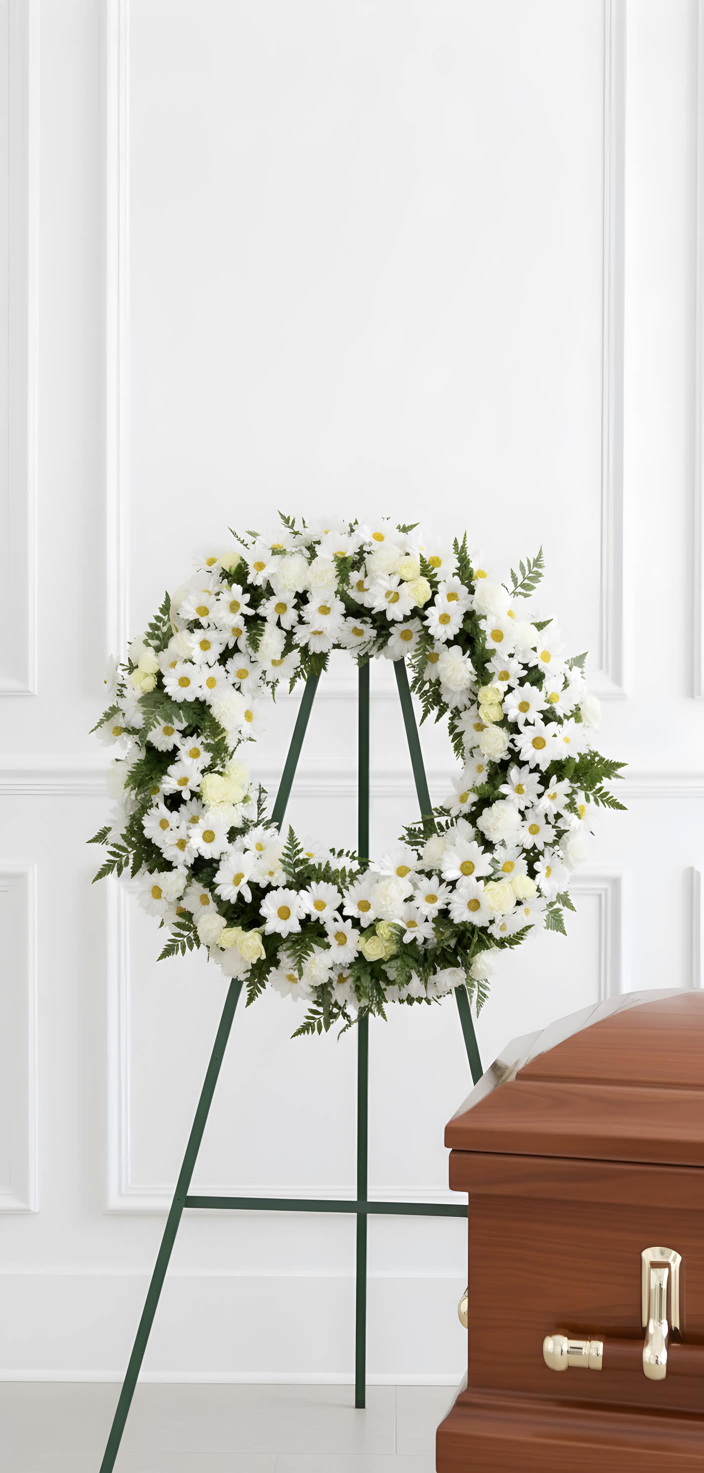 White Sympathy Wreath - A classic white and green sympathy wreath. 