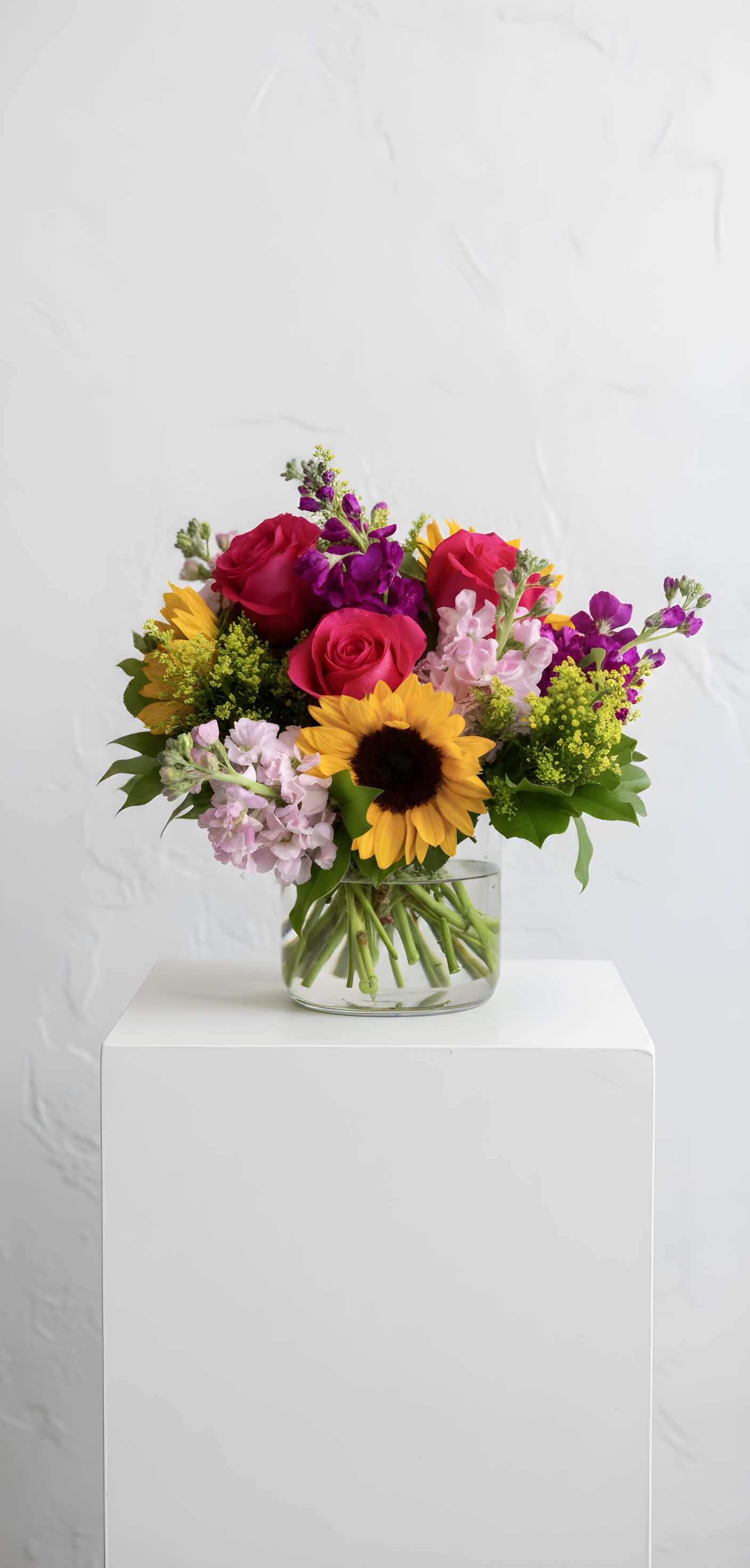 Summer Sorbet - A bright, cheerful mix of sunflowers and roses.
