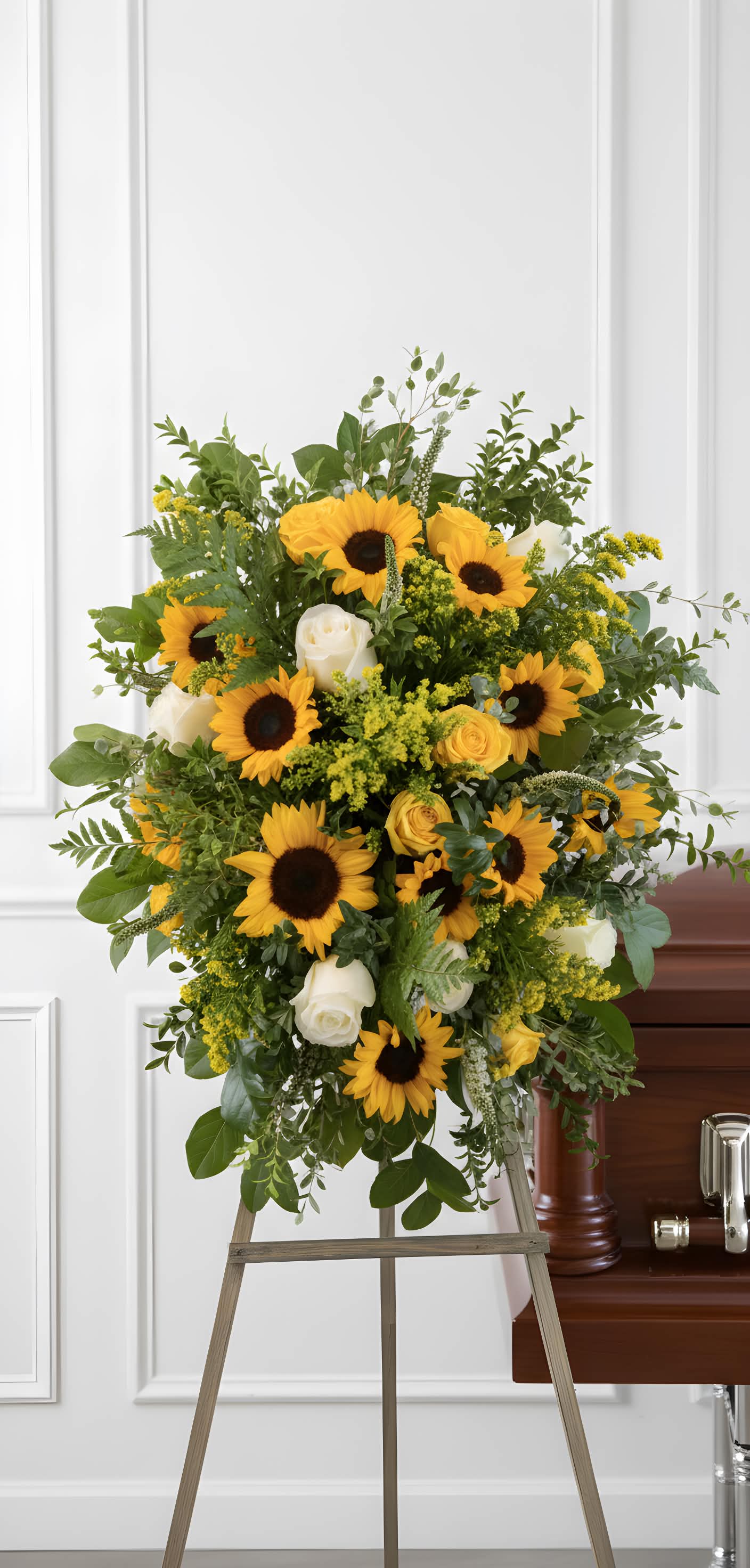 Sunflower Spray - A unique spray with various yellows bringing a smile to anyones face in times of sorrow. Plenty of blooms and blossoms fill this spray with love.
