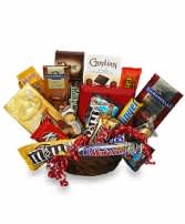 Basket filled with assorted candy bars and snack packs