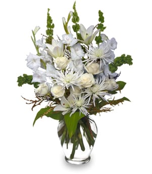 White mixed bouquet in a clear glass vase