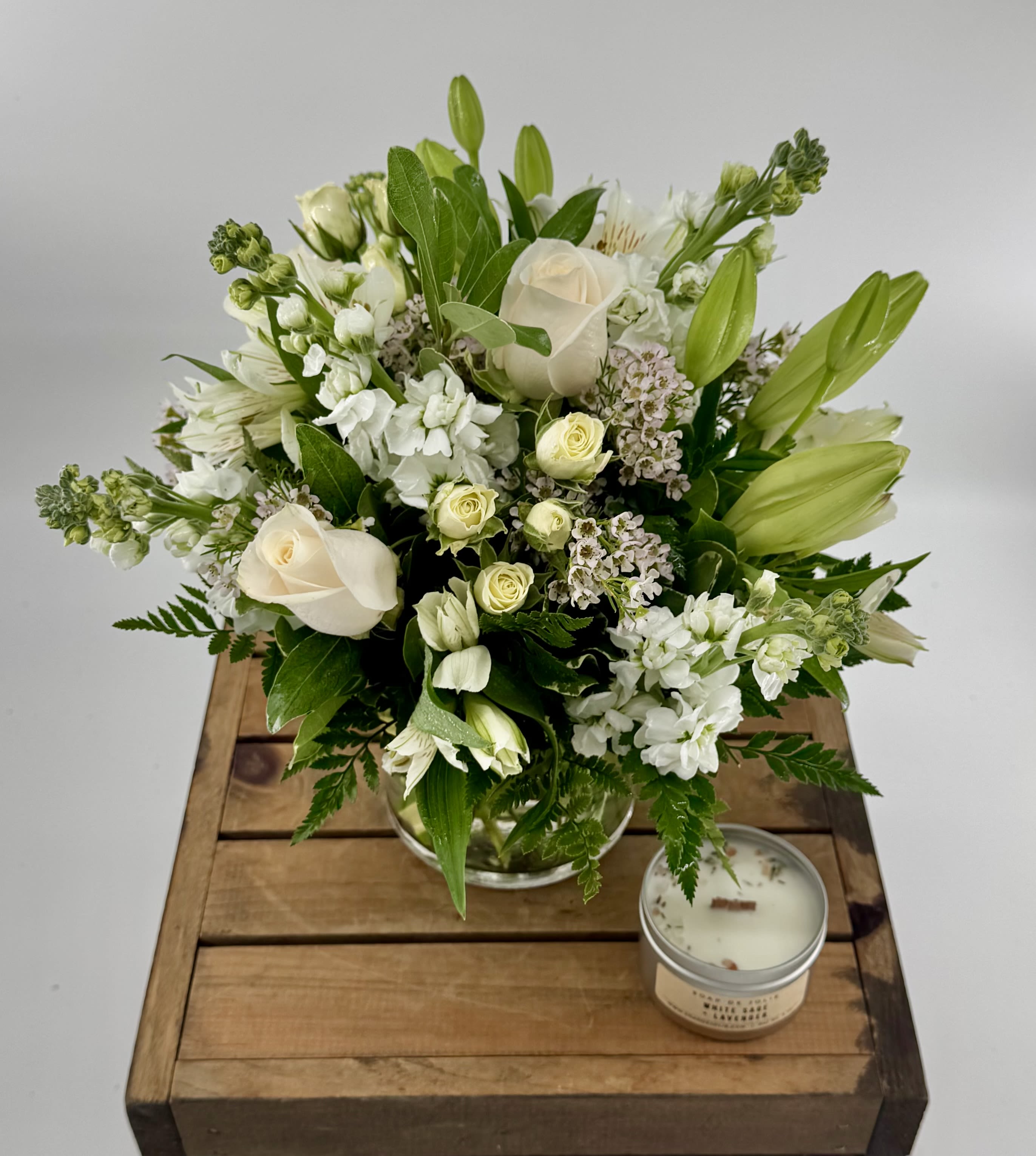 Isle of White (BB) - Introducing our All-White Elegant Flower Arrangement, a timeless and sophisticated masterpiece that exudes pristine beauty and grace. This stunning arrangement features a curated selection of all-white blooms, carefully arranged to create a sense of elegance and tranquility.  