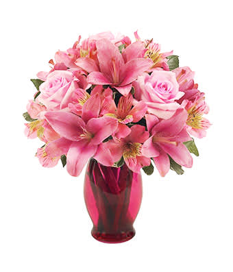 Ruby Array - An array of thankful emotions will overcome Mom when see receives this beautiful arrangement of pink Asiatic lilies, light pink roses and pink alstroemeria in a pink fluted vase. Measures 12"H by 10"L.