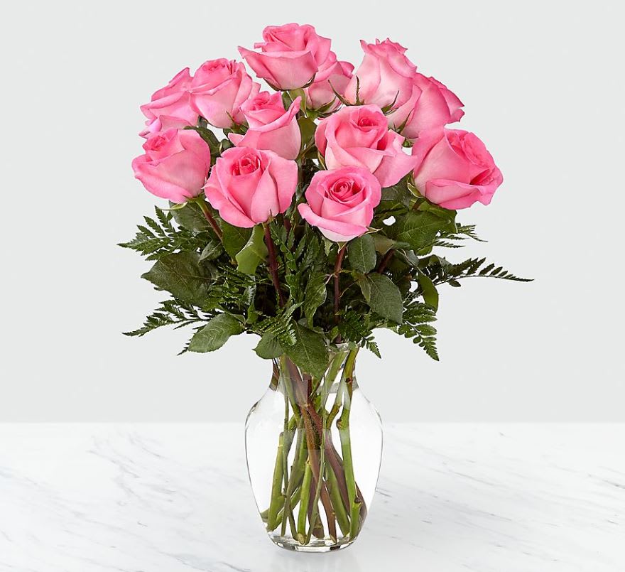 Smitten ™ Pink Rose Bouquet - Our Smitten™ Pink Rose Bouquet is the perfect way to say “I love you.” Whether you're sending this beauty to a friend, mother, colleague or love, each bursting pink bloom is a fun way to make your affection stand out this Valentine's Day! Sizes 12,18 or 24.  