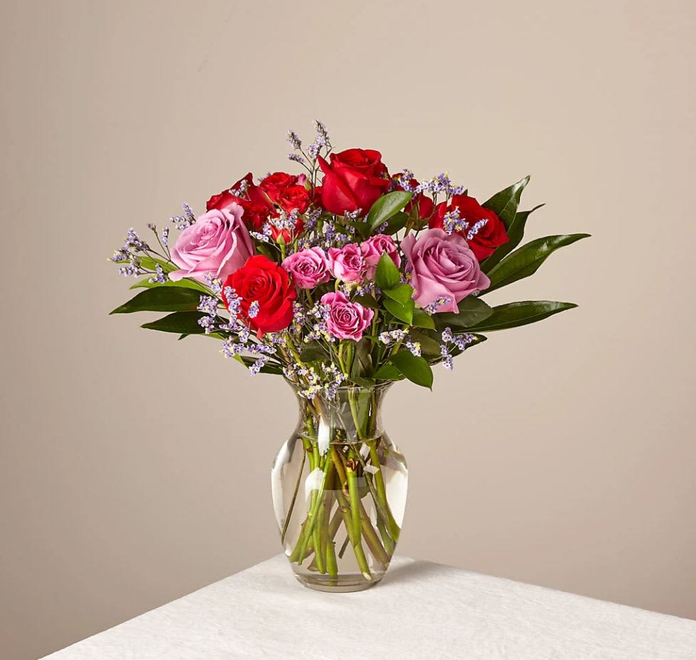 Head Over Heels Bouquet Original With Vase - The Original Bouquet is about 16"H by 16"W. A farm-fresh bunch of 16 floral stems and foliage. Includes a clear glass ginger vase. This bouquet comes with floral food and care instructions, packed carefully within a gift box. As soon as you take your bouquet out of the box, trim the stems at an angle and place them in room temperature water with flower food. For long-lasting blooms, trim the stems and replace the water daily. Stems: Eucalyptus, Silver Dollar, Limonium, Roses, Spray Roses.