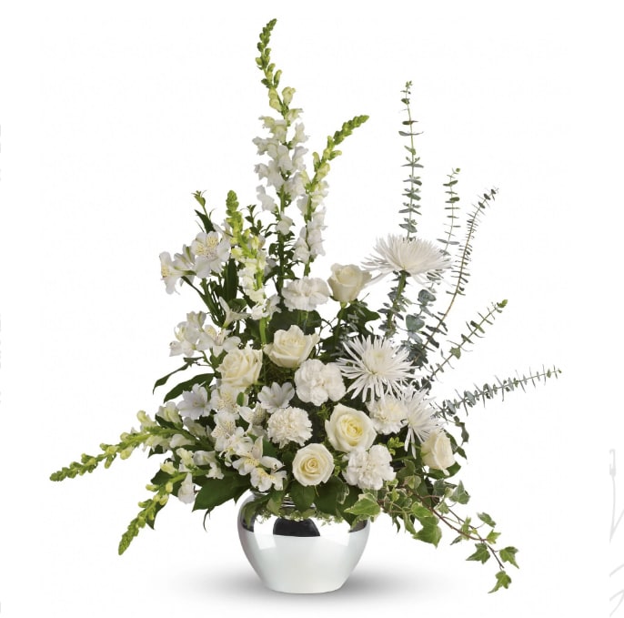 White floral arrangement in a silver vase with tall stems