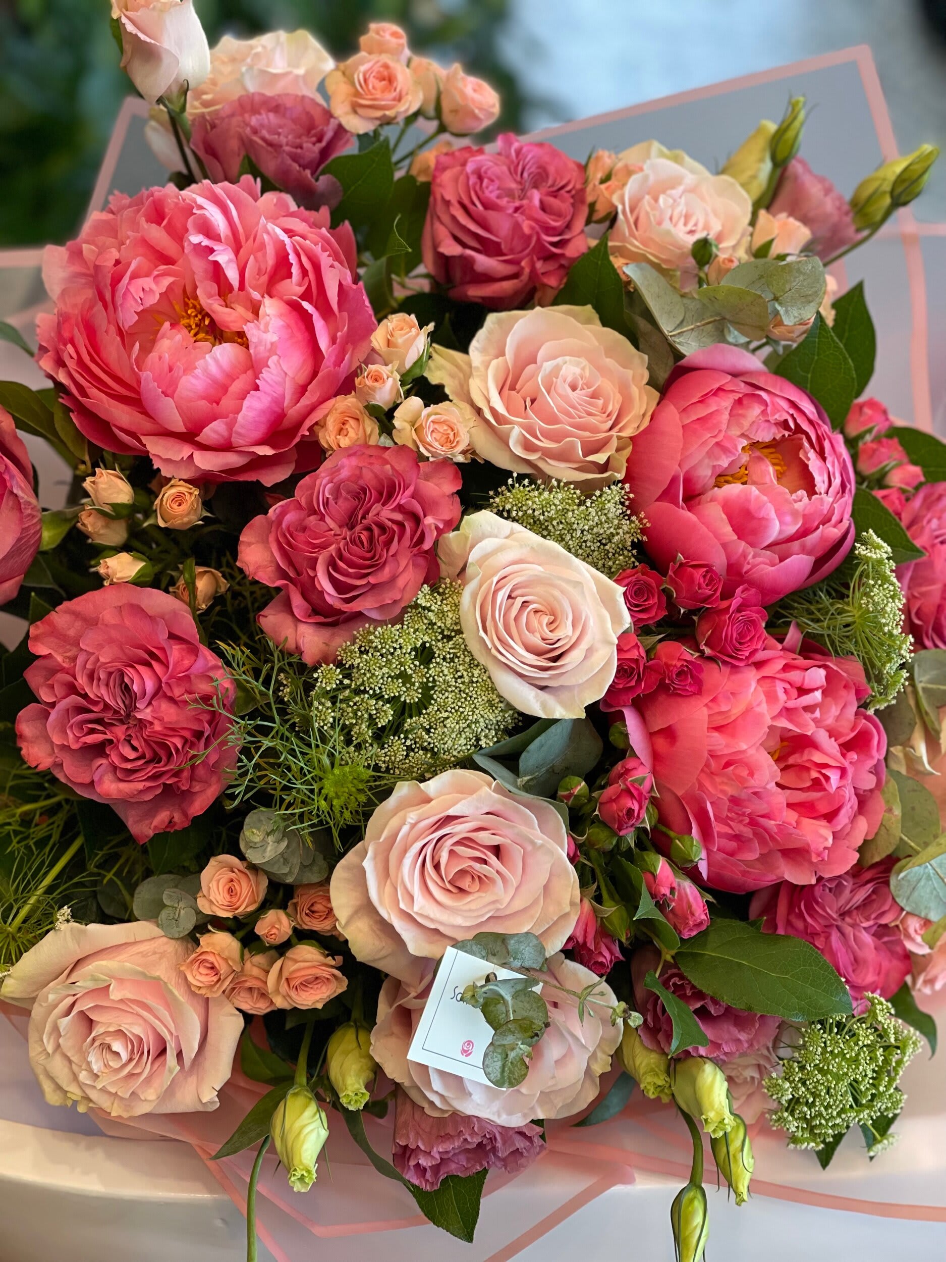 Pink and blush rose bouquet with peonies and small filler flowers