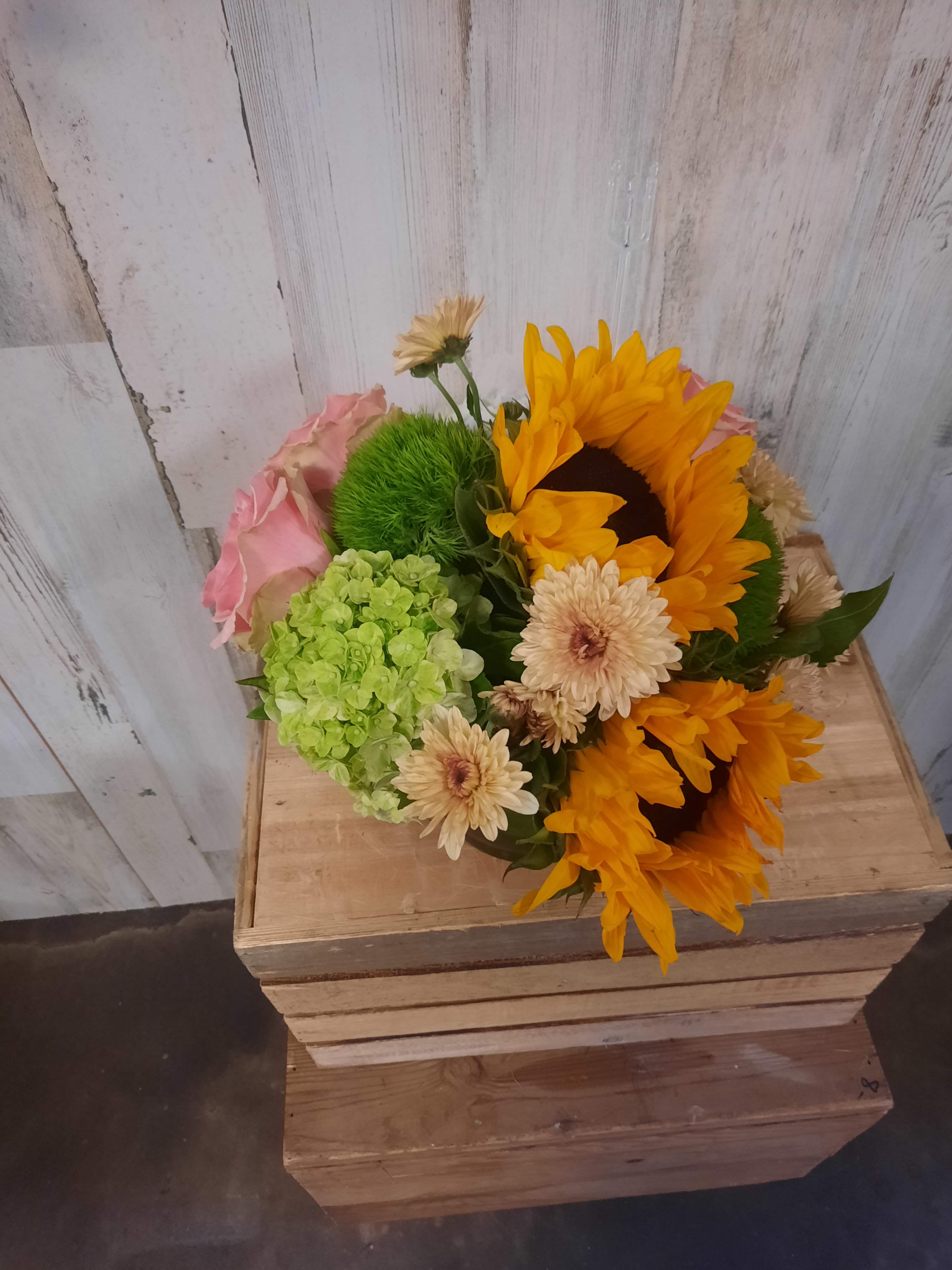 Bouquet with sunflowers, pink roses, and pale daisies