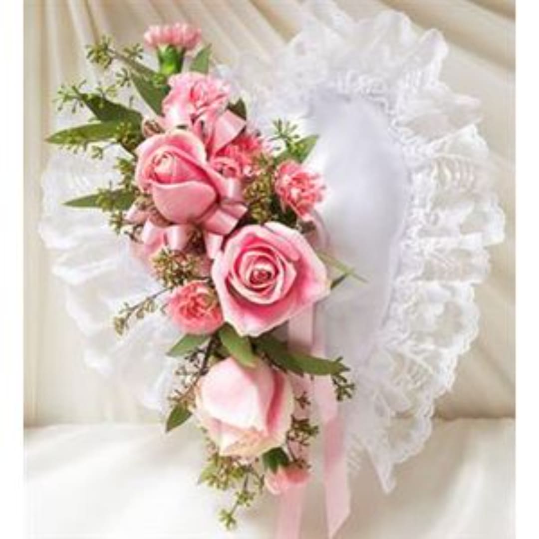 Pink rose corsage with white lace trim and ribbon