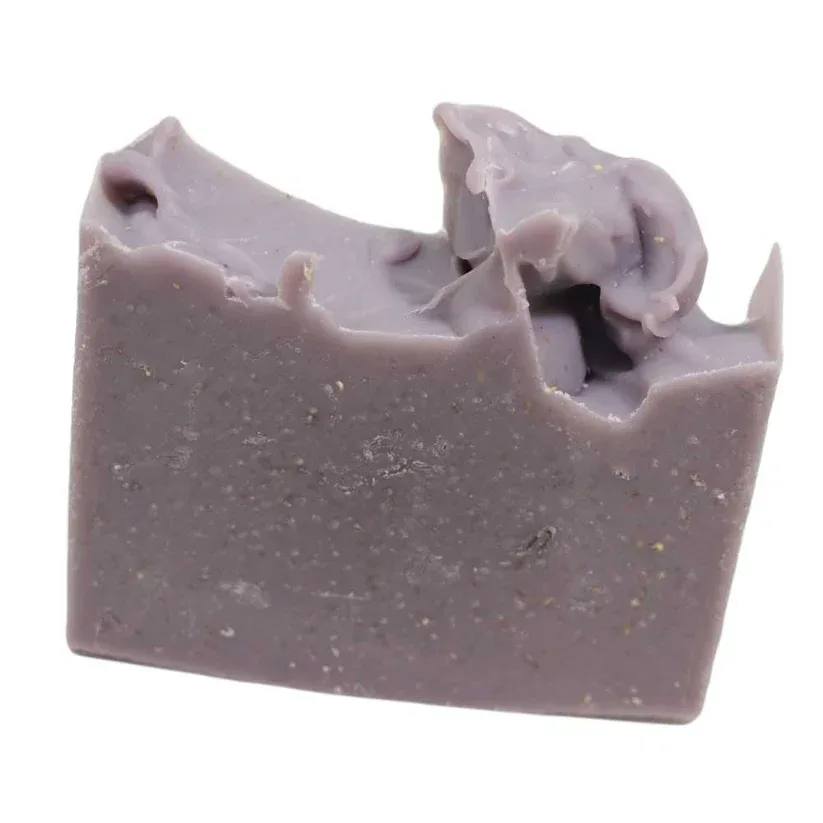 A lavender bar of soap with a rough, swirled top