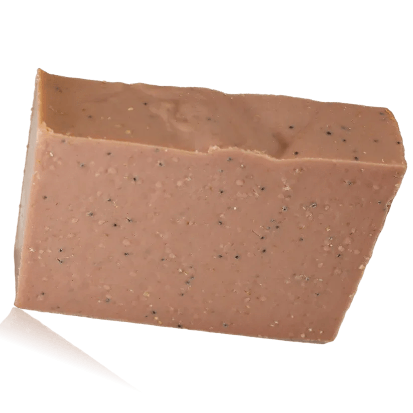 A rectangular bar of pink soap with speckled texture
