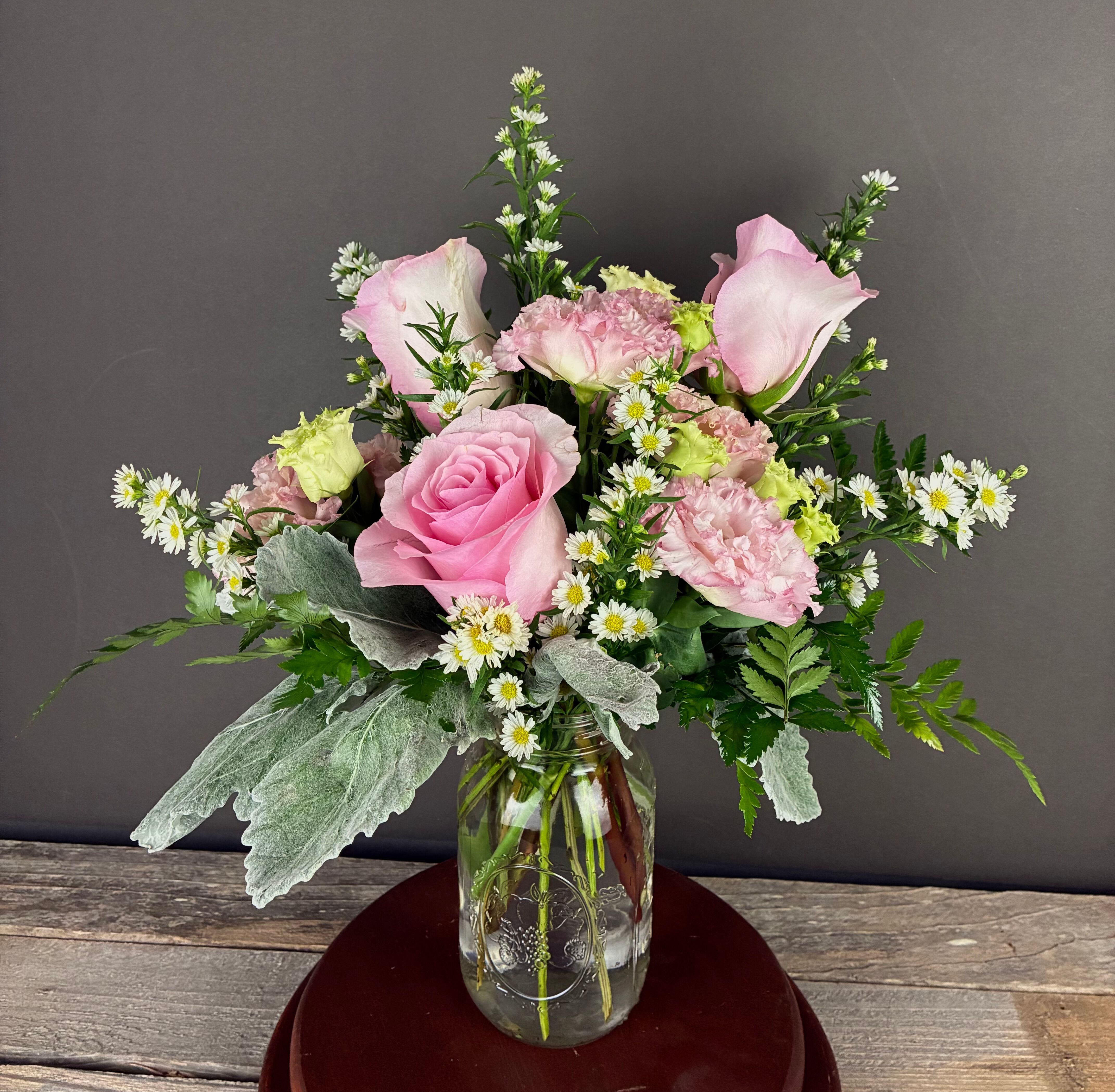 My Darling - A sweet arrangement of roses, lisianthus, and asters, perfect for so many occasions. Gift it to your sweetheart, send it to someone who needs a smile, or send it to new parents to celebrate the arrival of a little one! No matter the occasion, this arrangement is sure to brighten anyone's day.  Occasionally, depending on our available flowers, we may need to change the colors of flowers in this arrangement. If the original color is important to you, please call us or indicate in the check out notes upon purchase. Thank you.