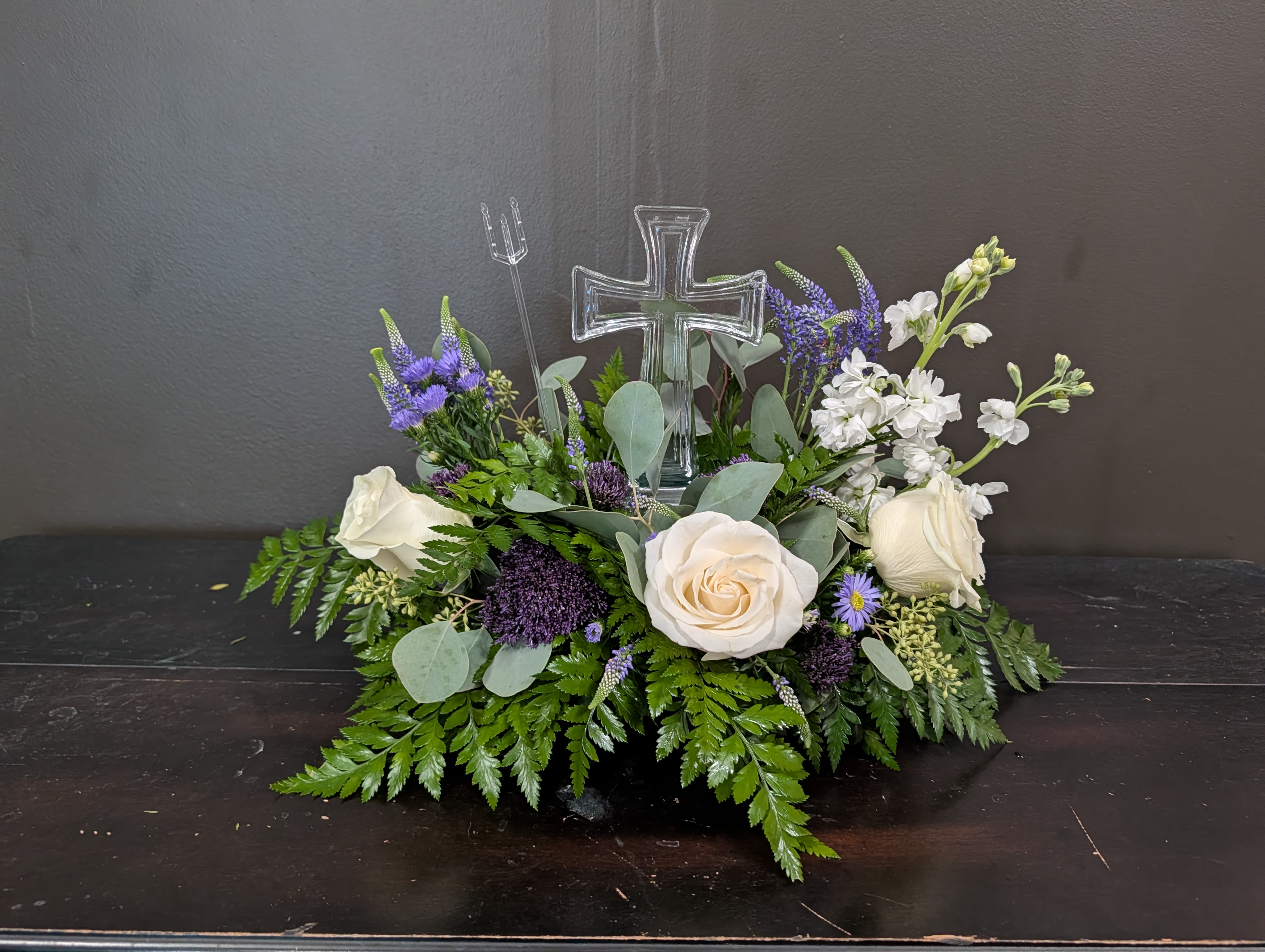 Crystal Cross Serenity  - A crystal Cross surrounded by greens and filled with white and lavender florals